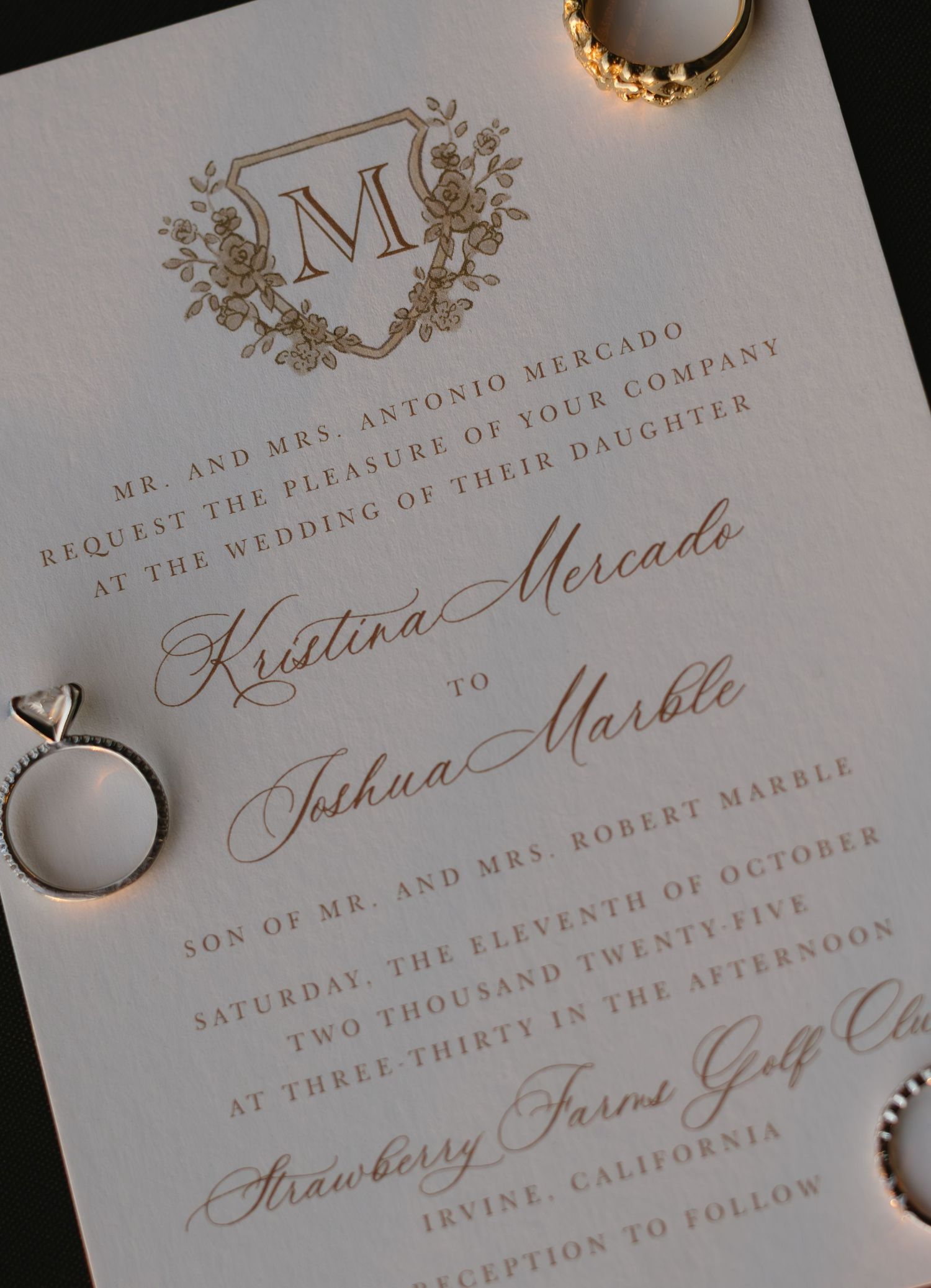 Classic wedding invitation details with ornate calligraphy and monogram design.