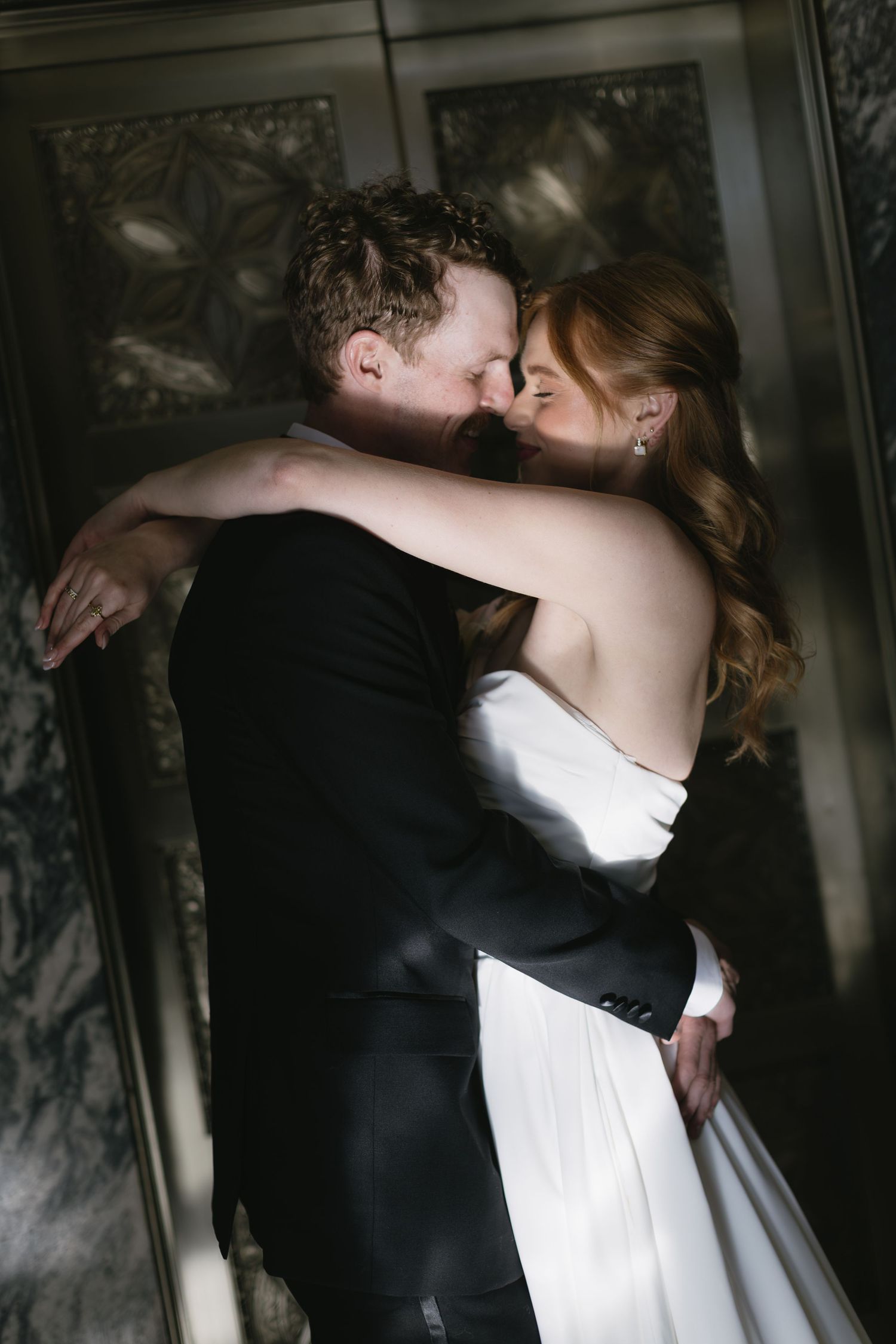 Romantic sequence of a couple embracing in formal wedding attire.