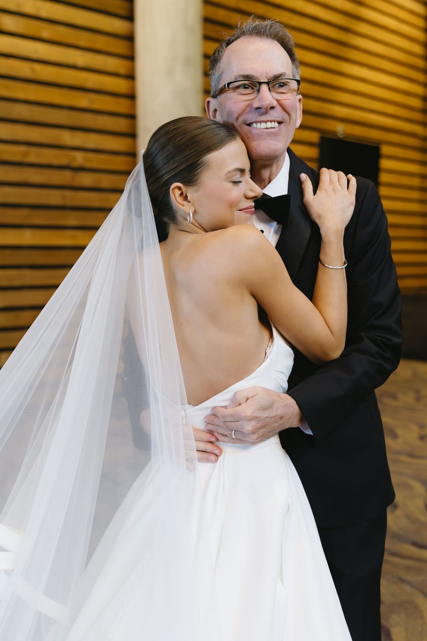 Emotional wedding moment captured in sequence with flowing white veil.