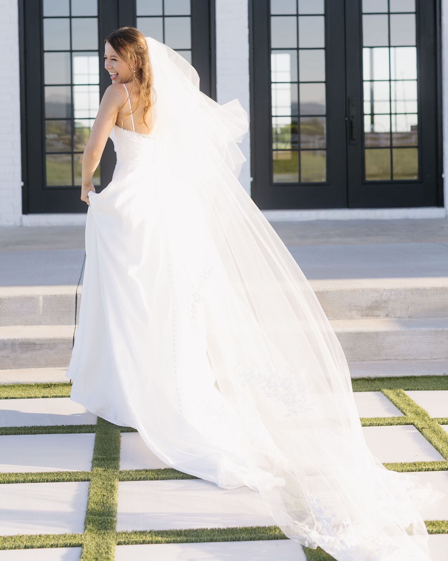 Sequence of outdoor bridal portraits against a white building with black-framed windows.