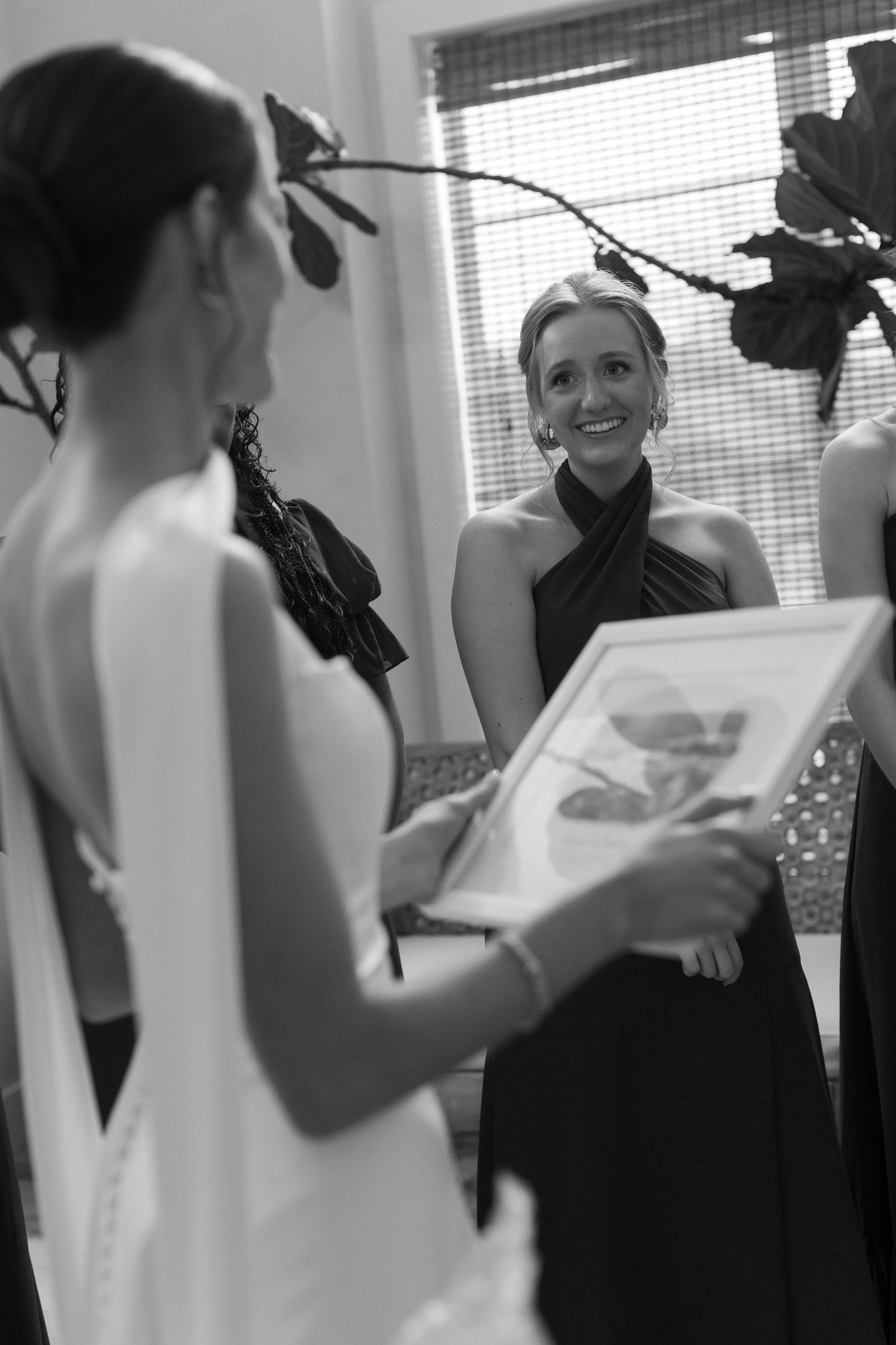 Wedding party gathers around to read heartfelt letters before the ceremony.