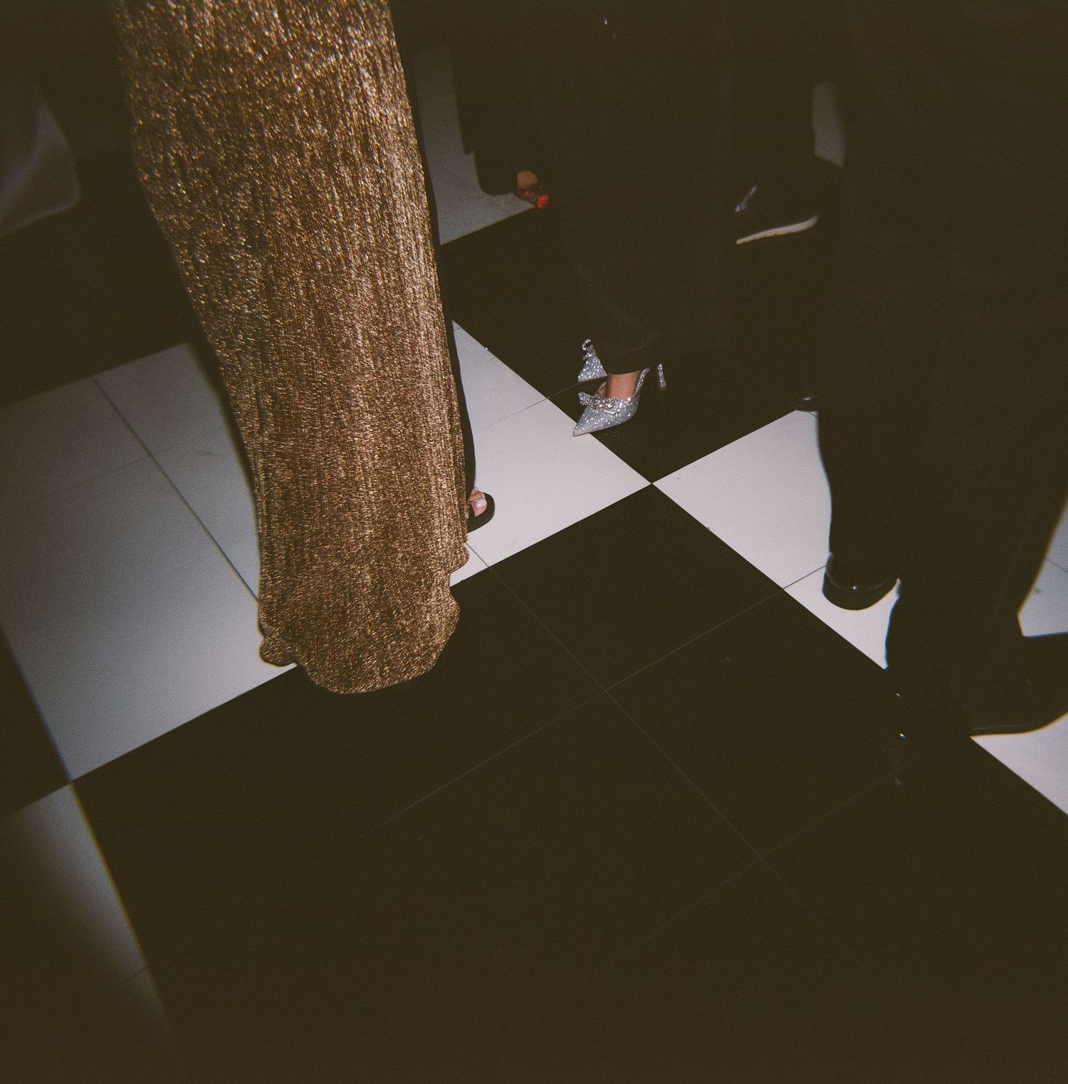 Abstract black and white wedding reception photos with dramatic shadows and lighting.