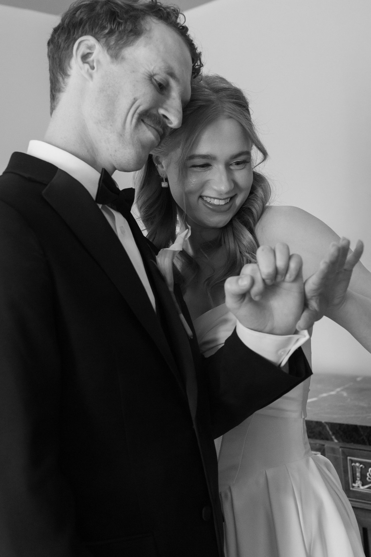 Black and white candid photos capture intimate moments between the newlyweds.