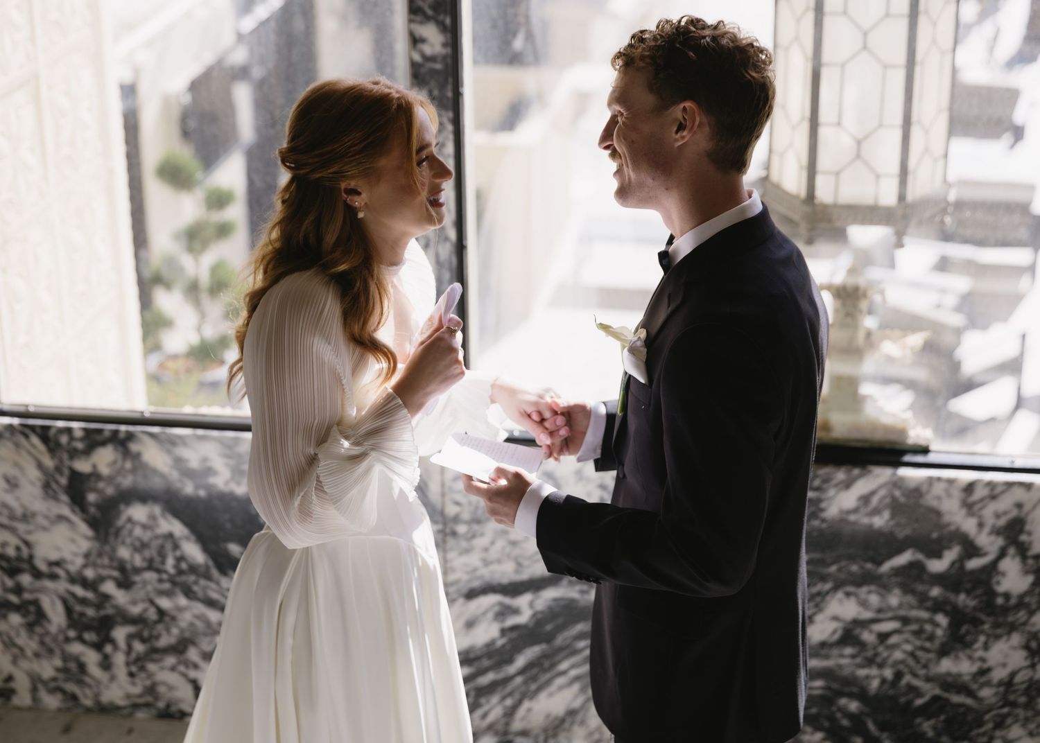 Wedding couple sharing romantic moments together in an outdoor setting.