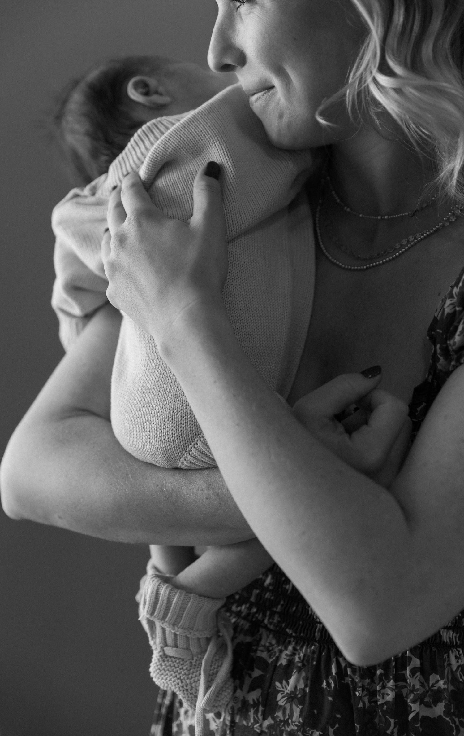 Black and white artistic profile shots showing tender family moments in close-up.
