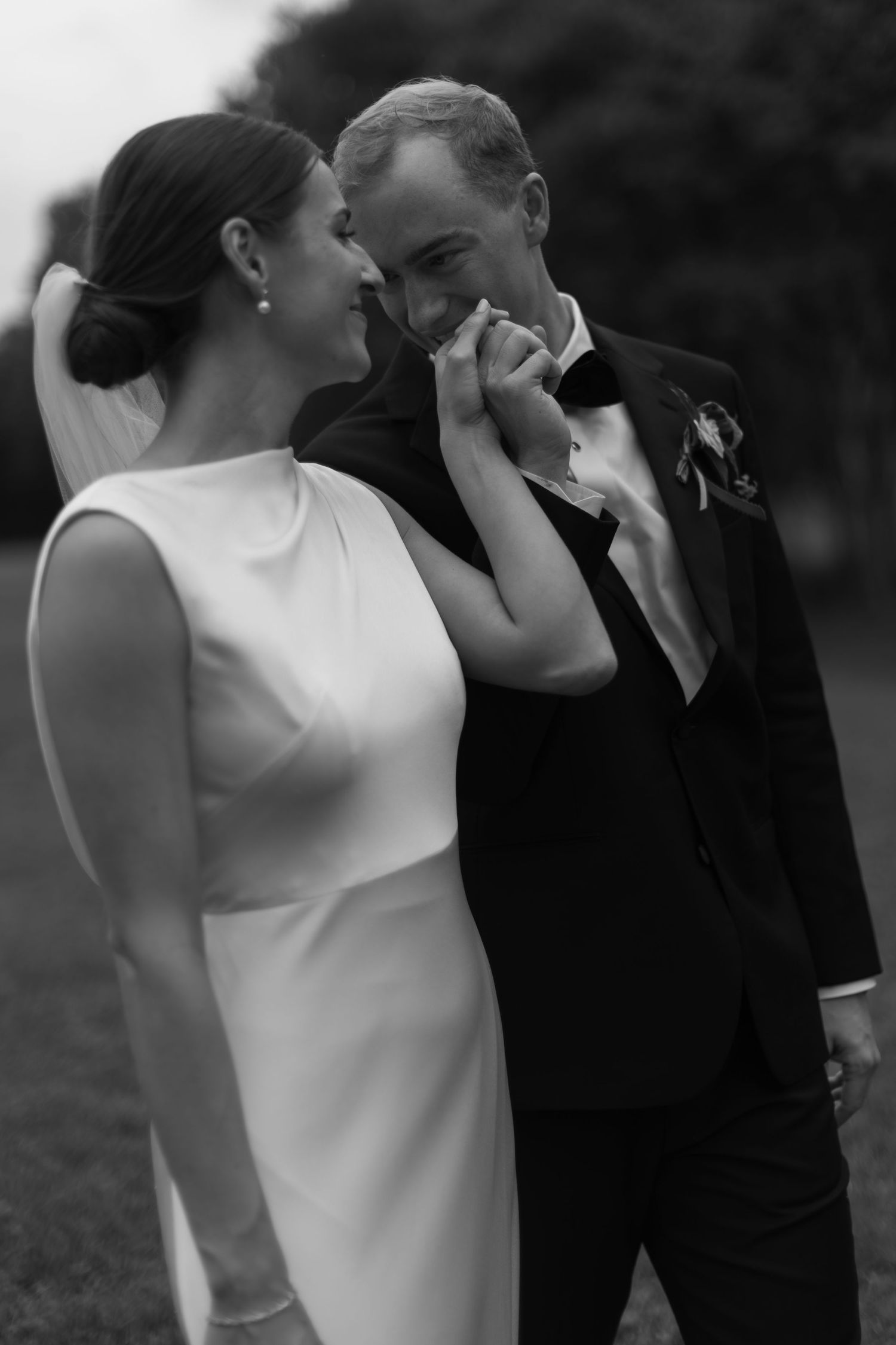 Black and white sequence of a couple emotionally dancing together in wedding attire.