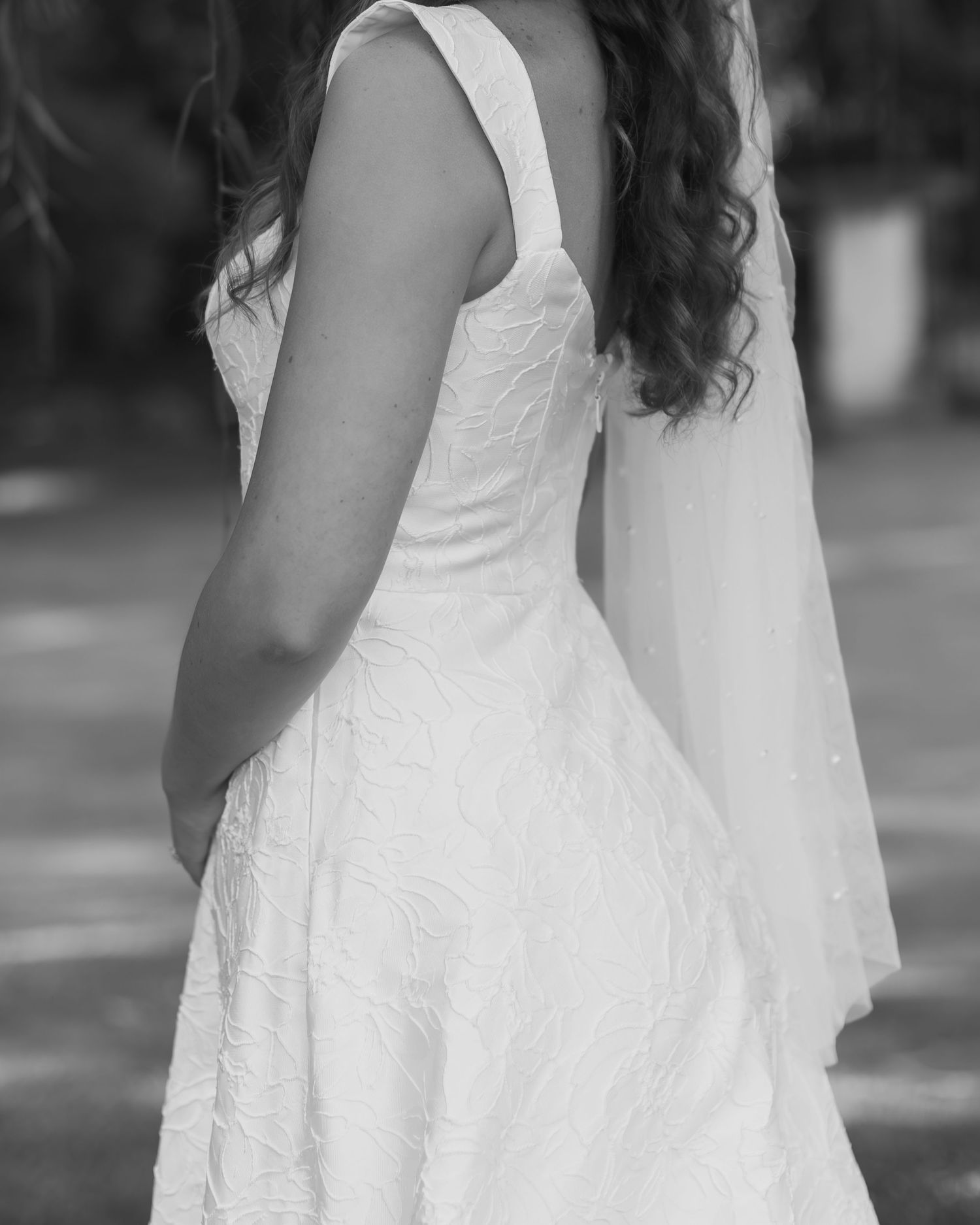 A close-up series of a white lace wedding dress showing the delicate fabric details from different angles.