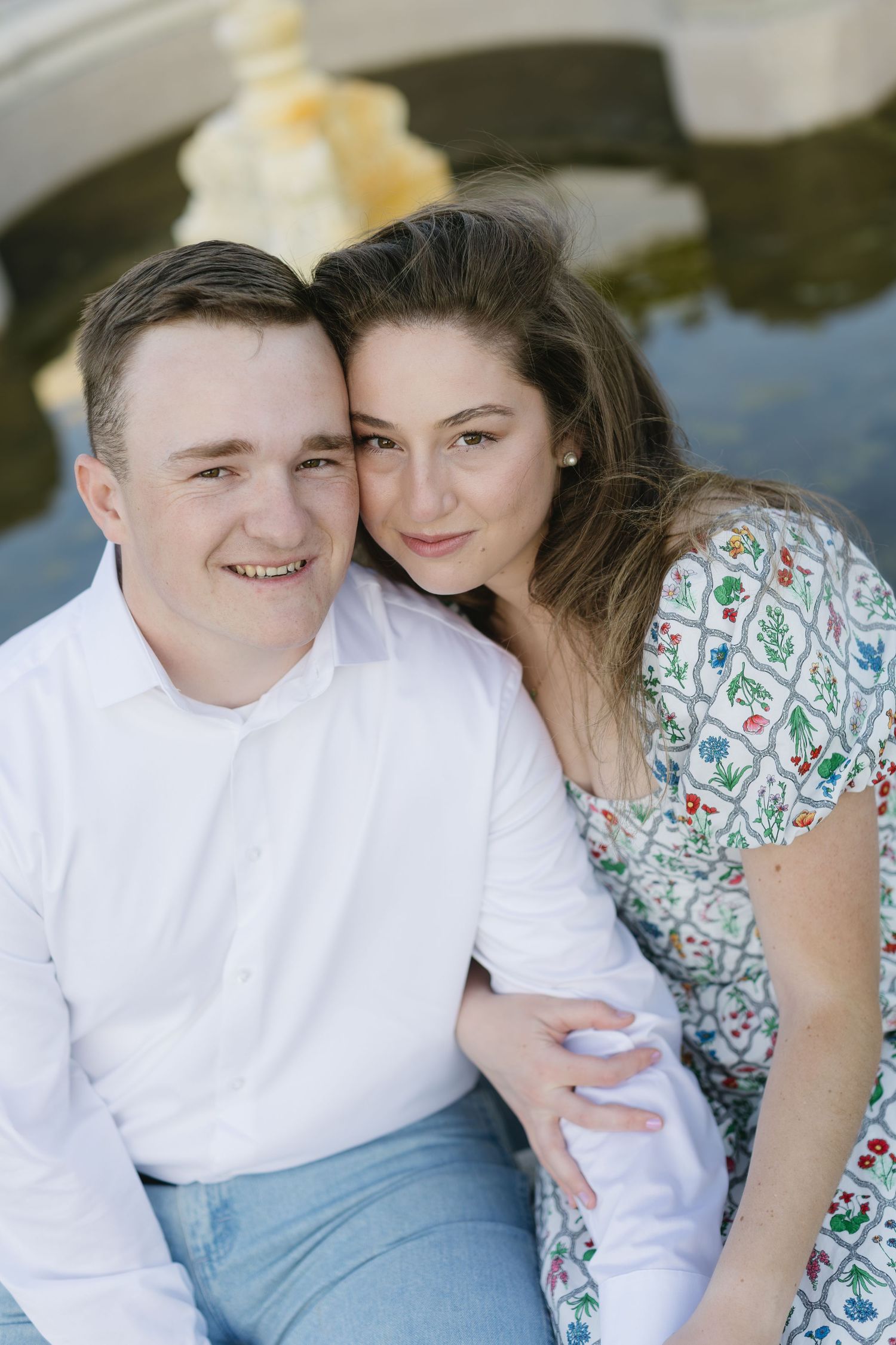 A couple shares tender moments together during an outdoor photo session.