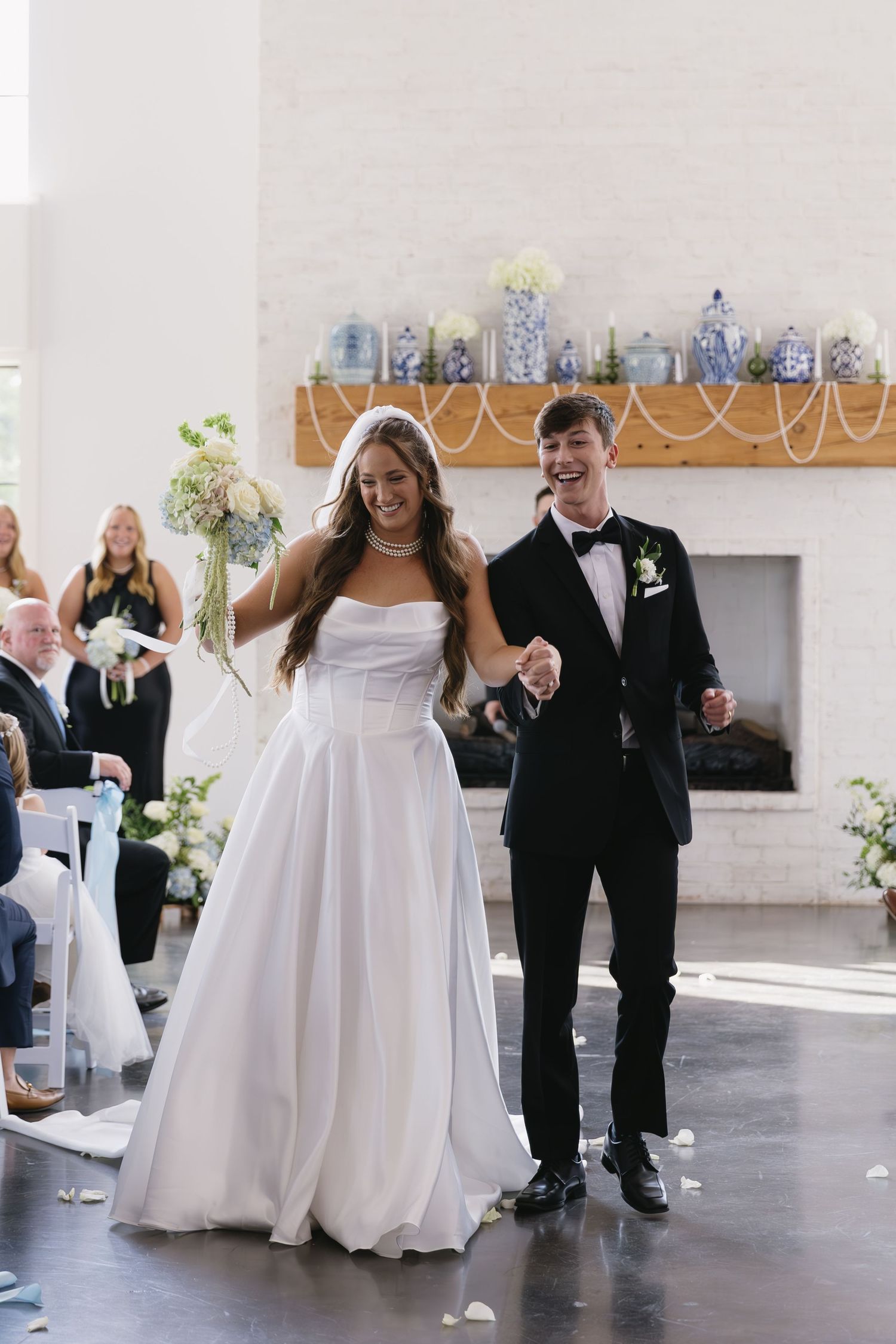 Indoor wedding reception showing joyful dancing and celebration moments.