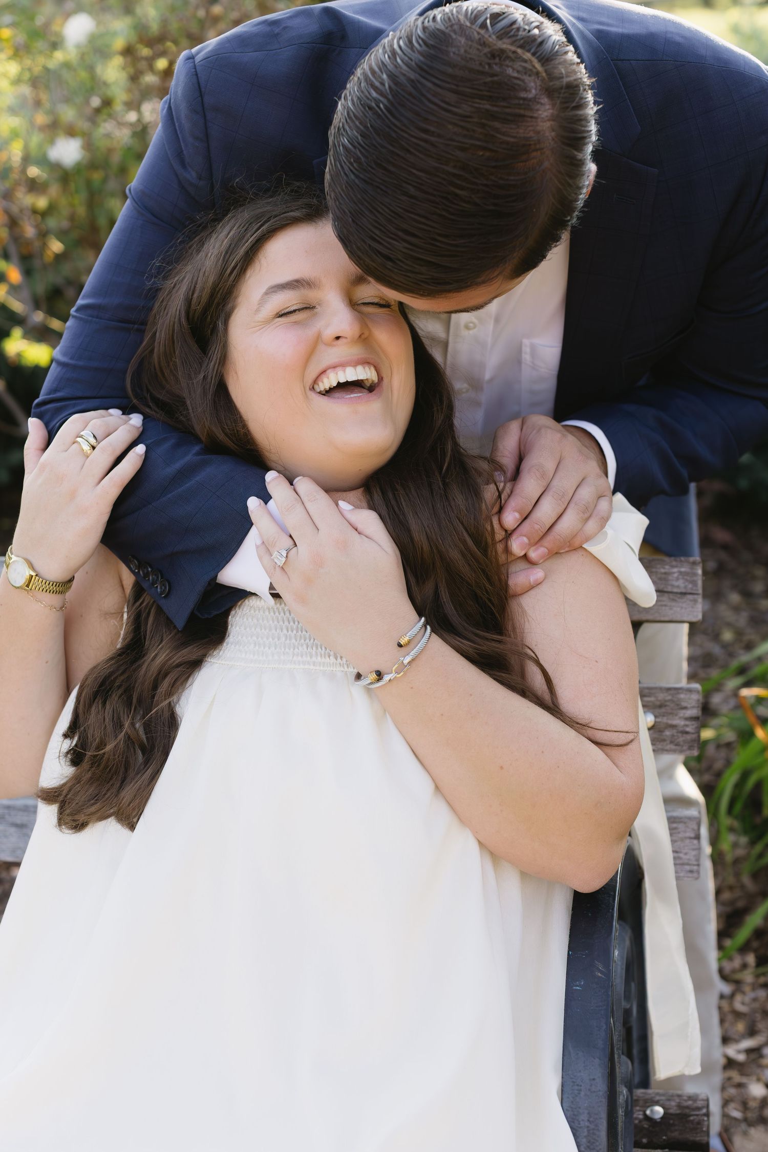 Candid moments of laughter and affection between a couple during an outdoor photoshoot.