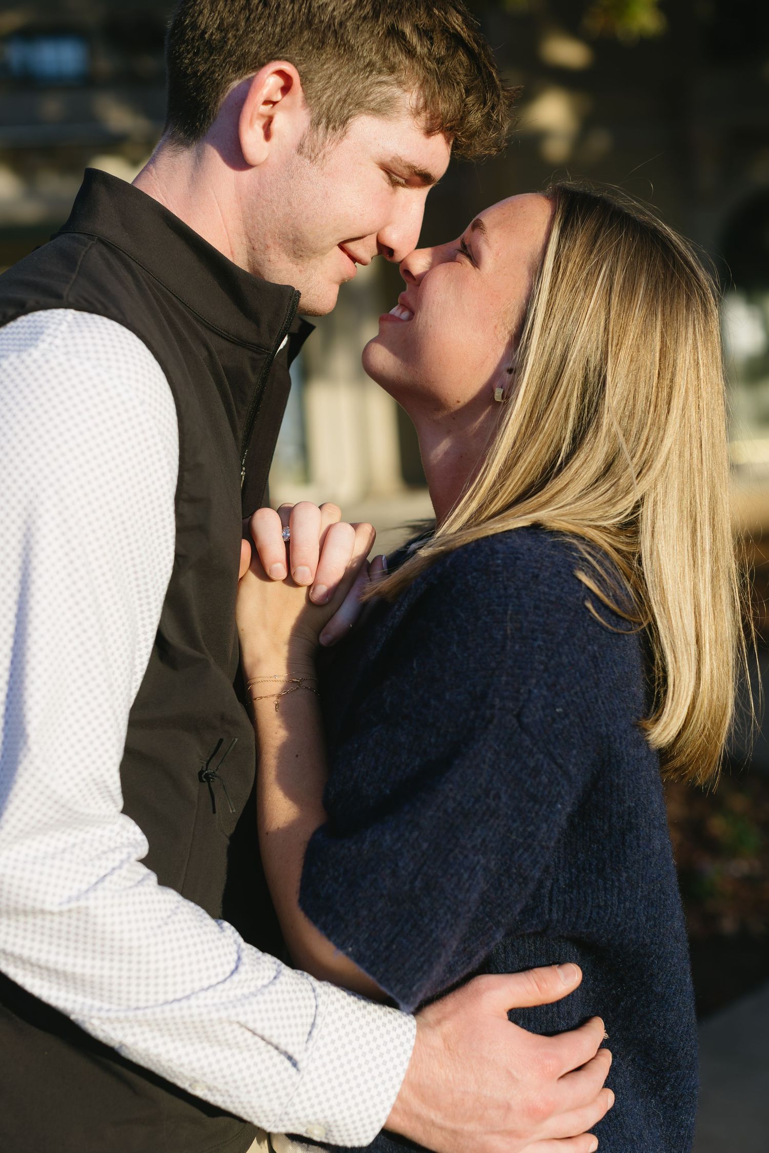 Intimate couple's portrait with soft lighting showing tender moments and genuine emotion.