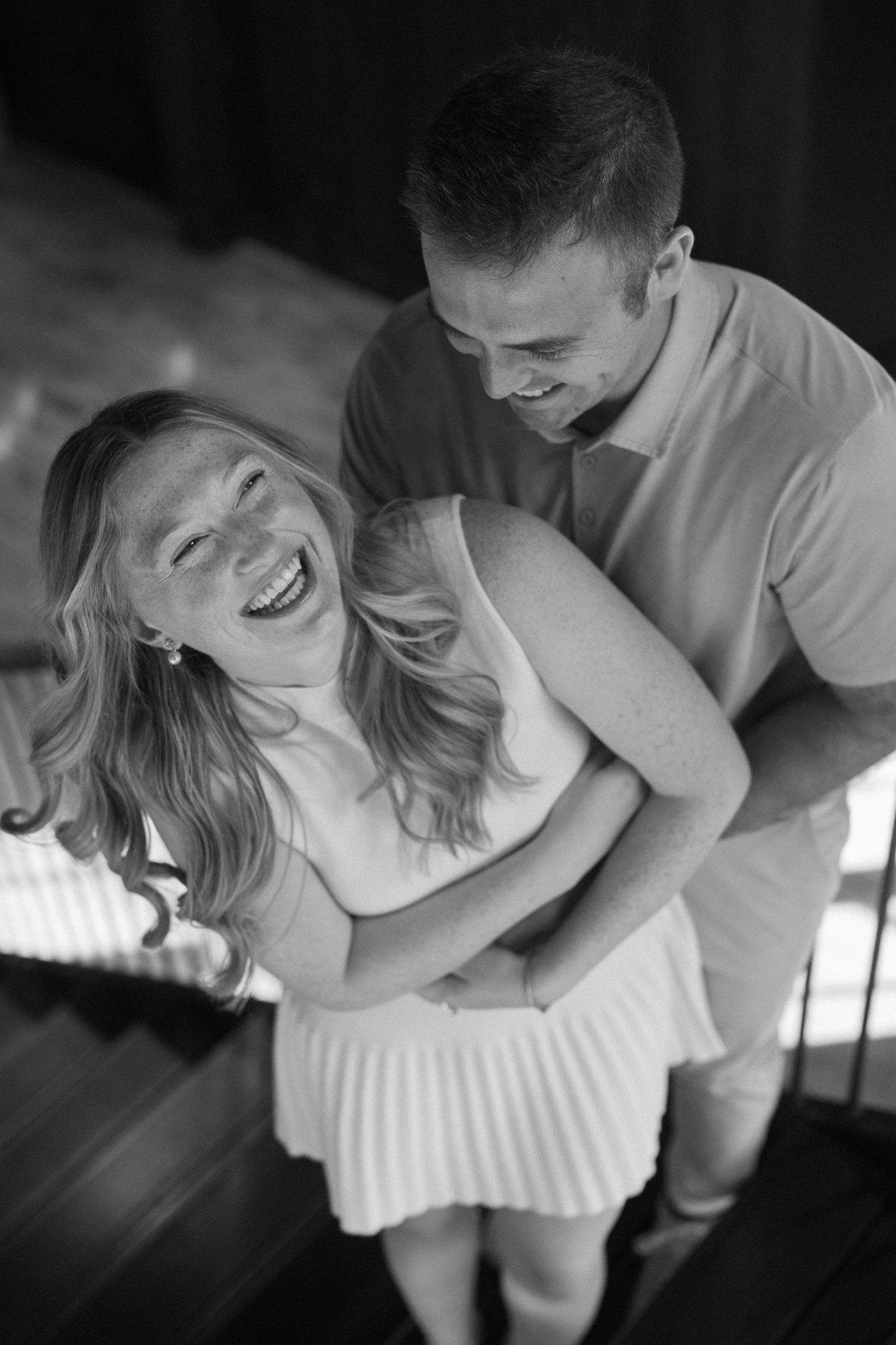 Intimate black and white photo sequence showing a couple in a tender embrace.