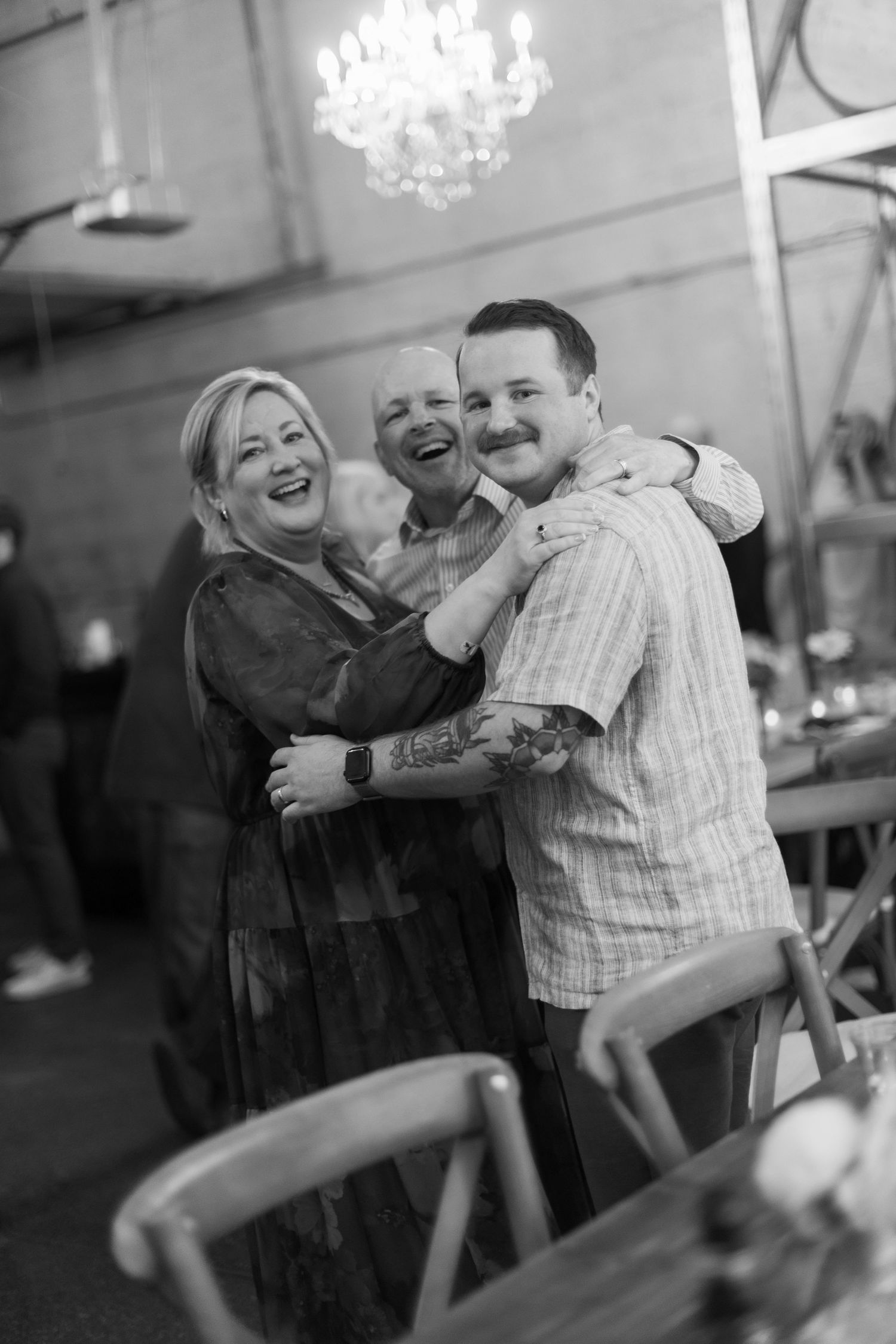 Black and white candid dance photos showing joyful moments at a celebration.