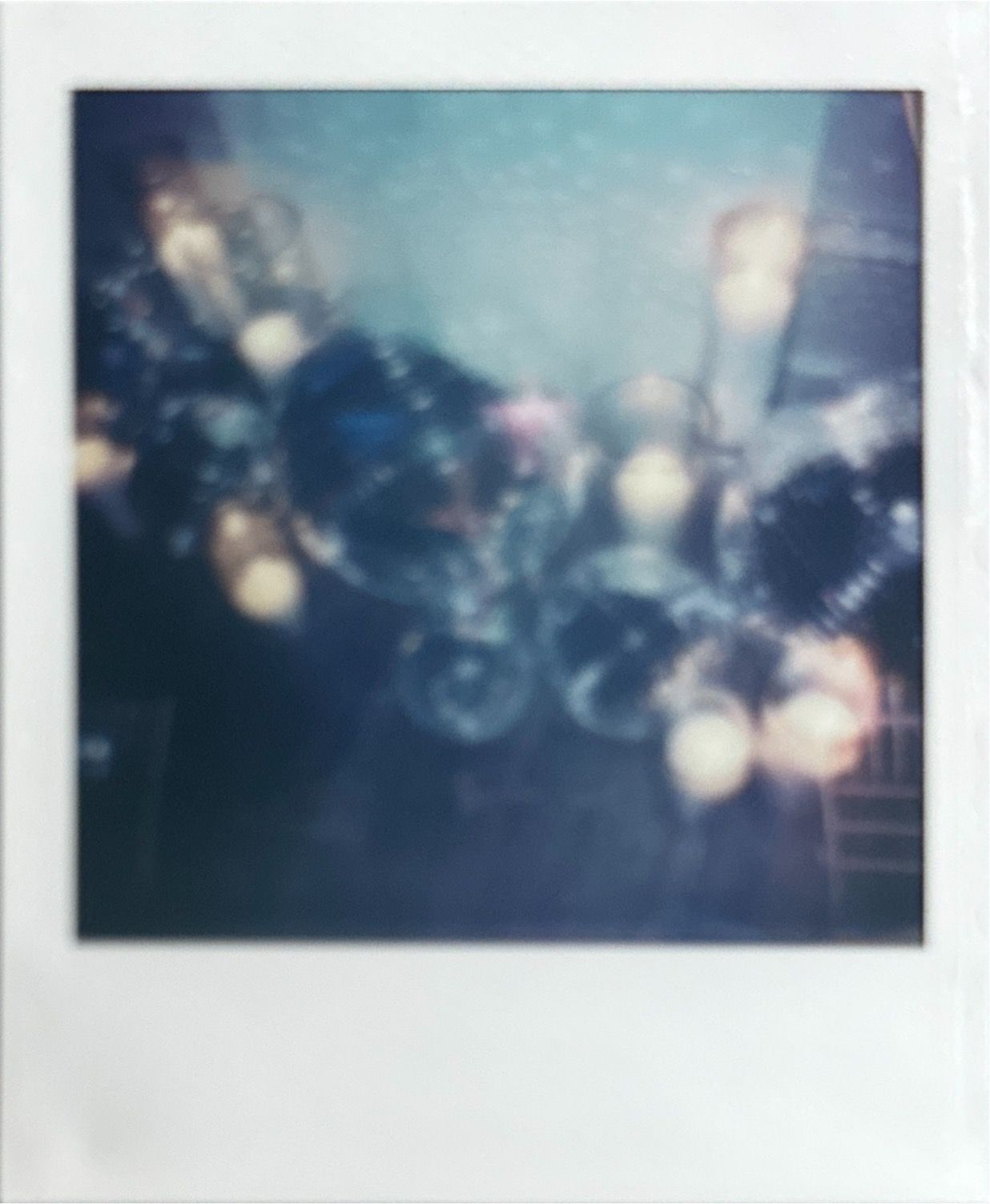 Dreamy polaroid photos with bokeh lights from wedding reception.