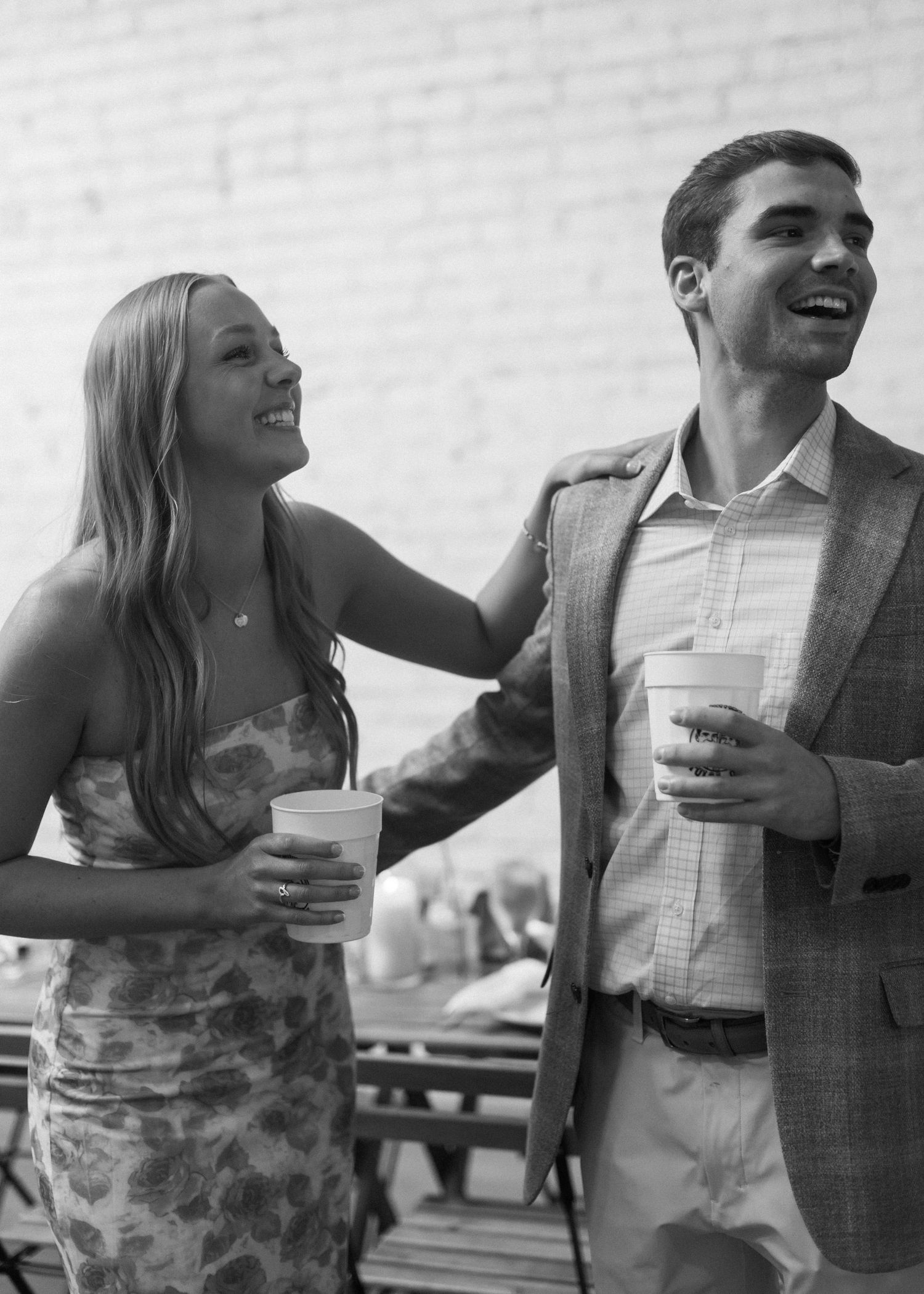 A couple shares laughter in black and white, multiple sequential shots showing joyful moments.