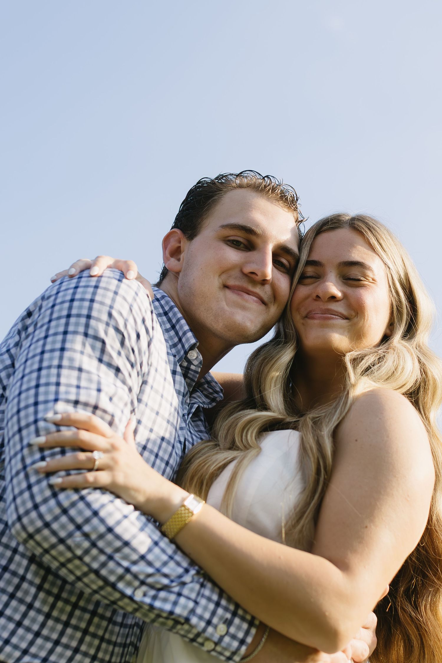 A playful series of candid outdoor photos showing a couple embracing and laughing together in natural light.