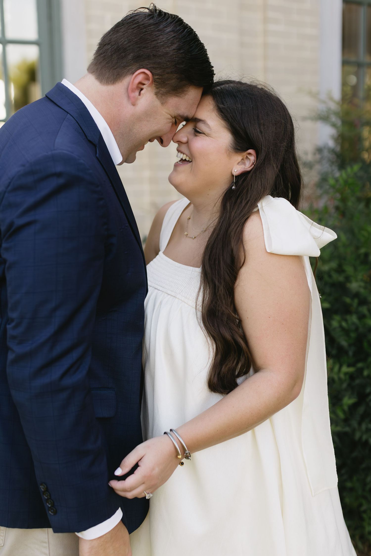 A romantic moment between a couple as they share a close embrace outdoors.