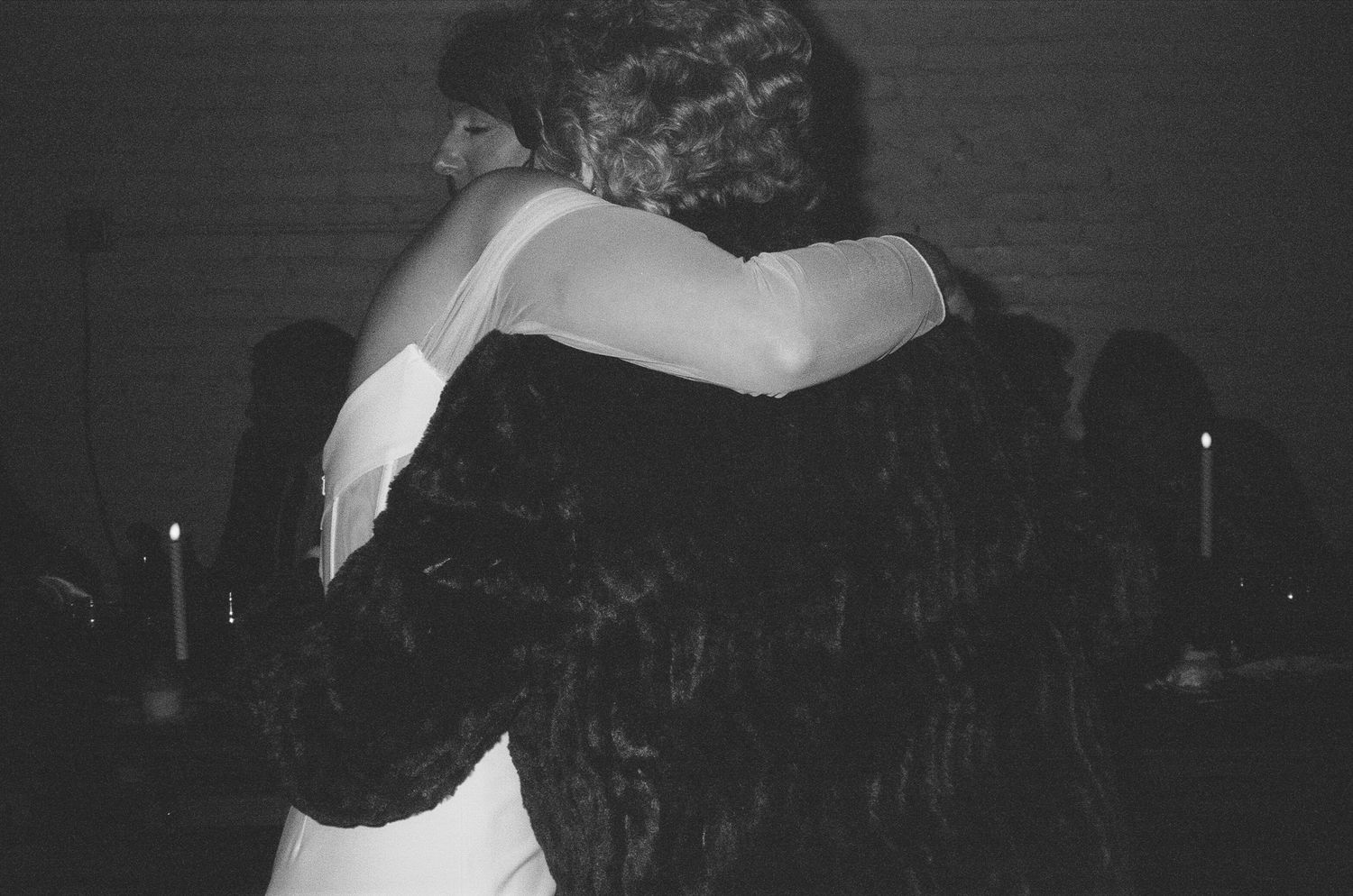Black and white intimate dance moment at a wedding reception.