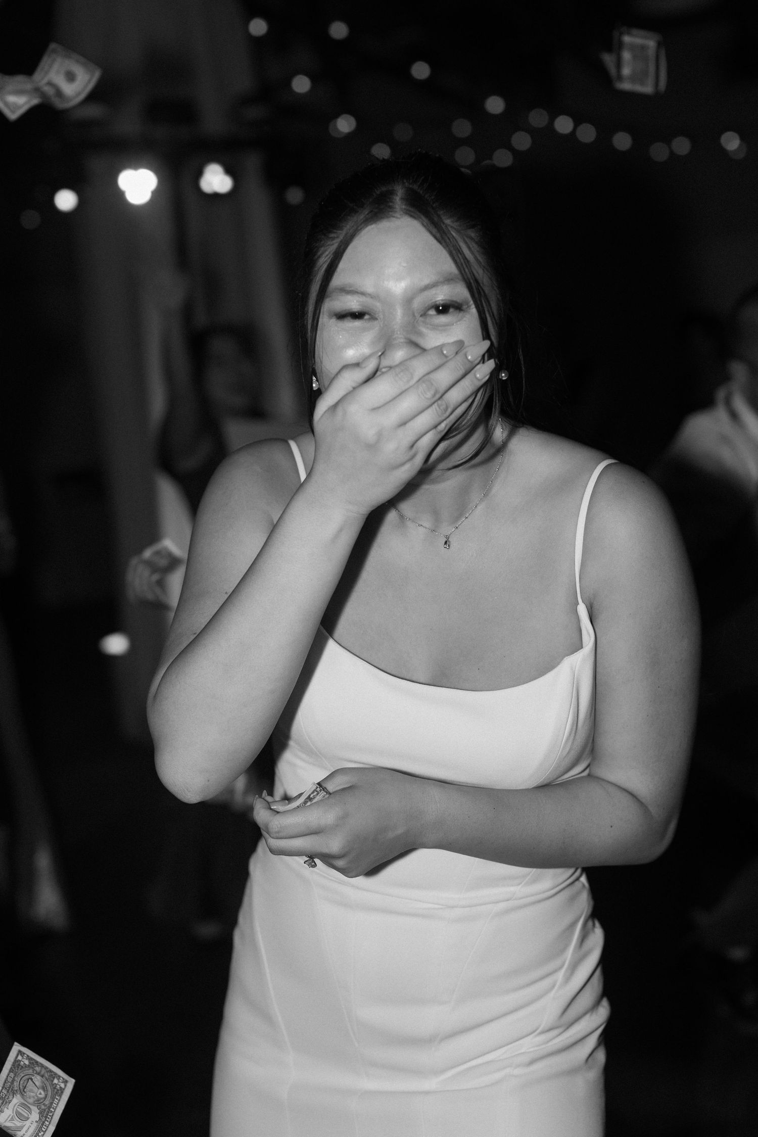 Black and white photos of wedding reception dancing and celebration moments.
