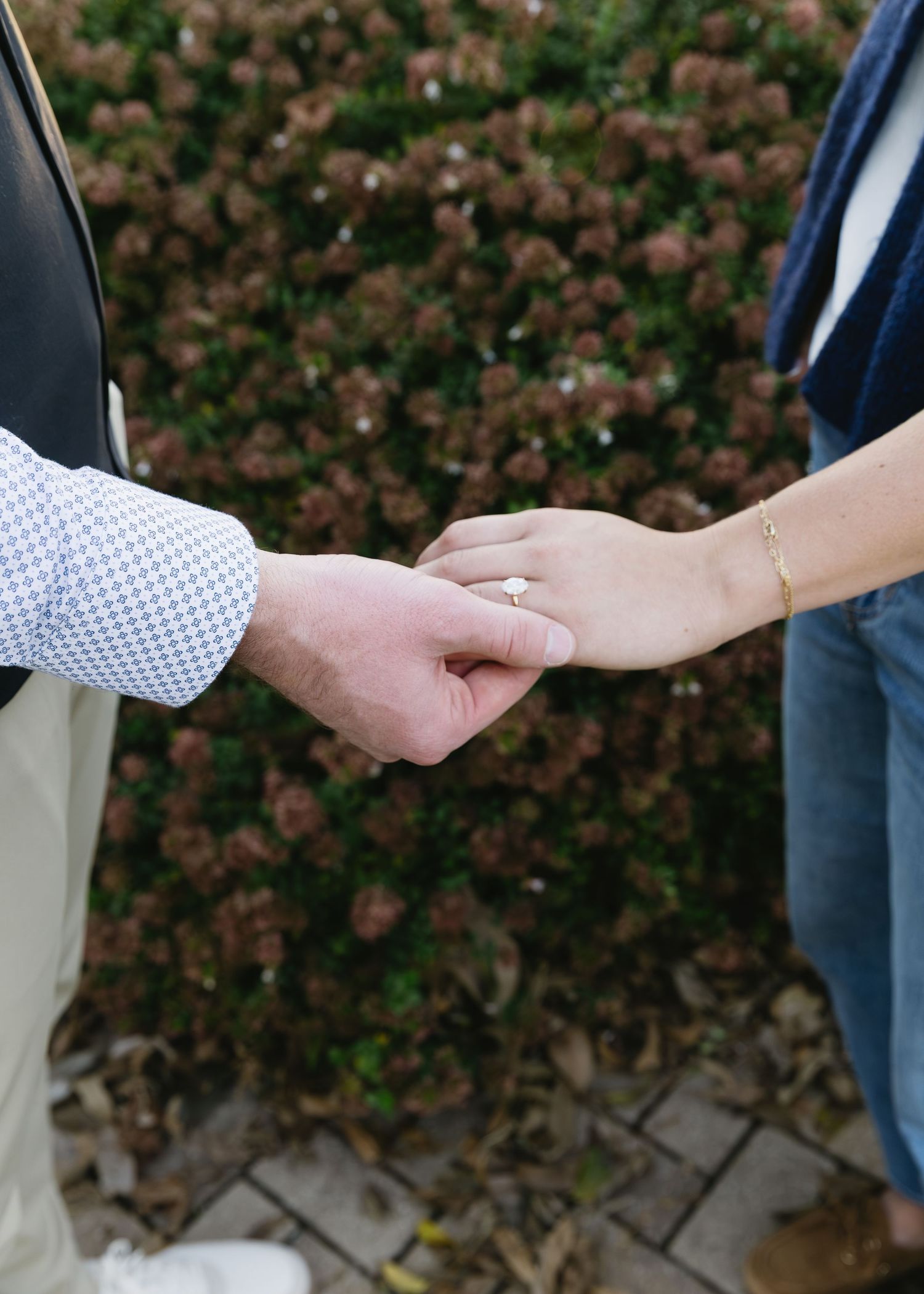 Close-up of hands reaching toward each other in an intimate gesture.