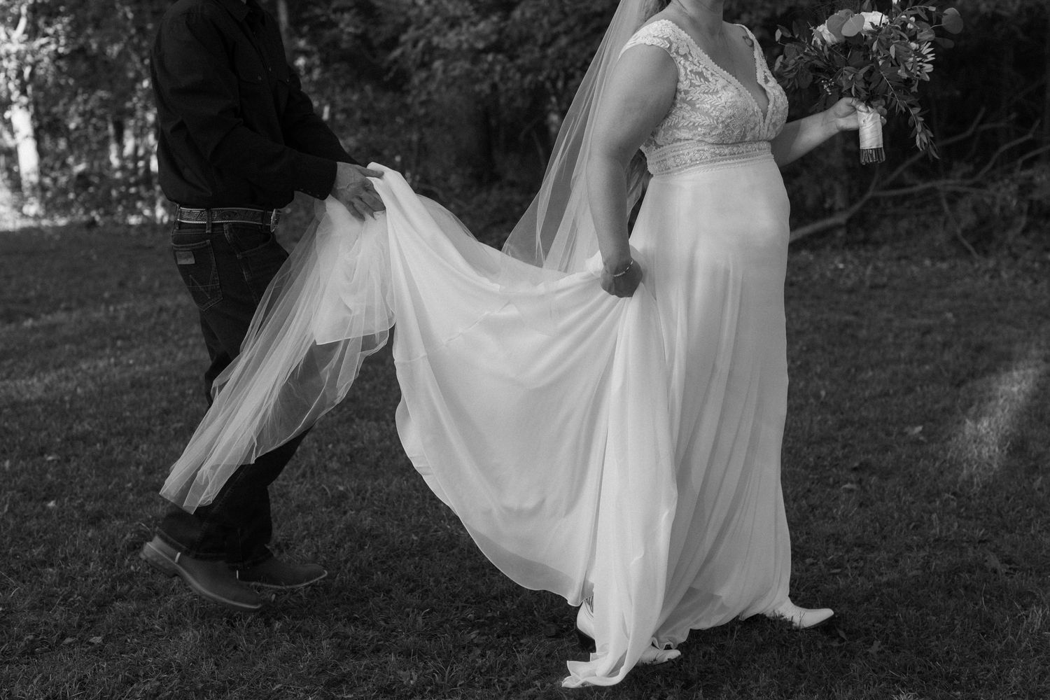 Black and white wedding photos showing movement of dress in outdoor setting.