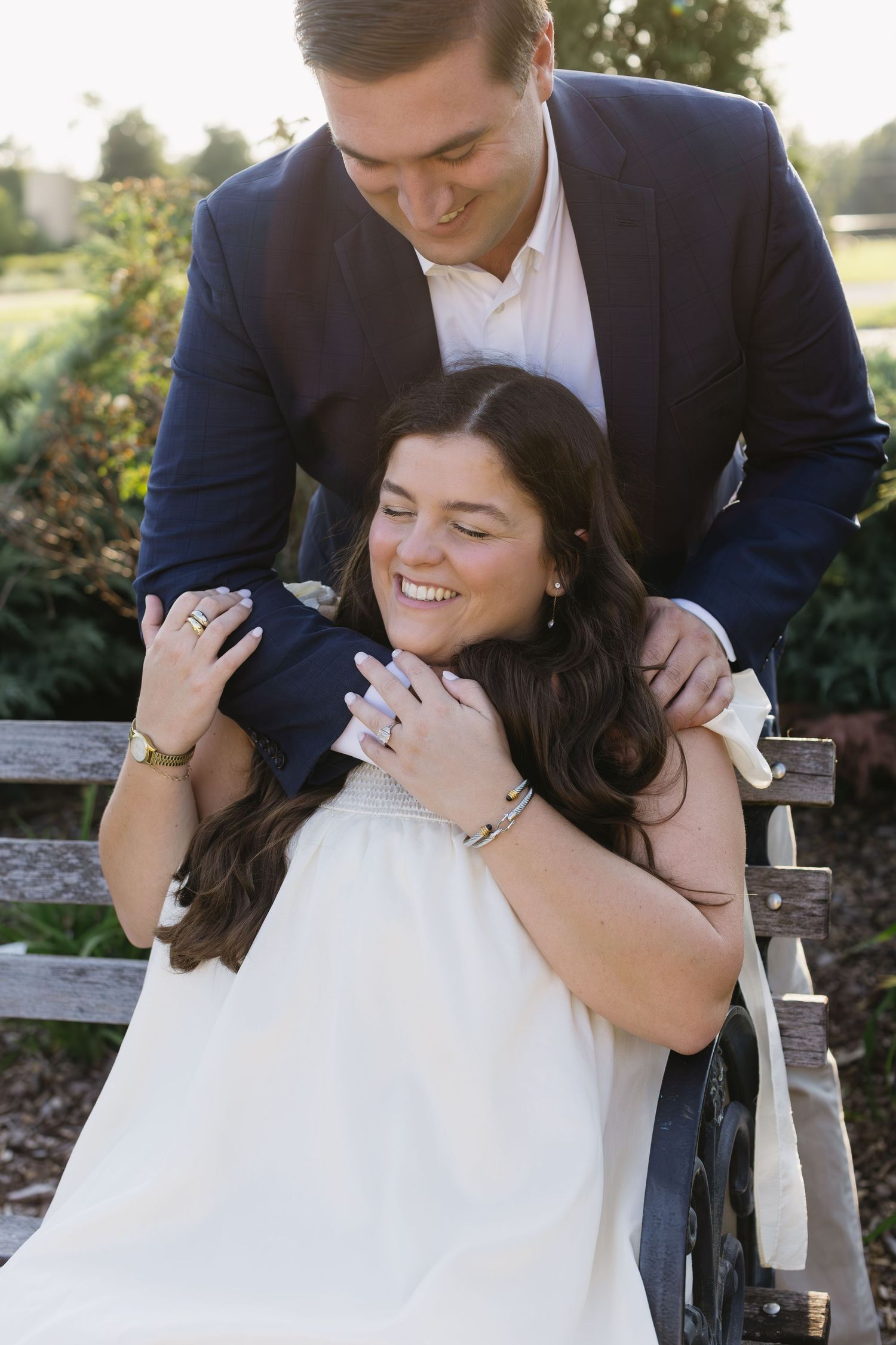 Playful candid moments shared between a couple during an outdoor photo session.