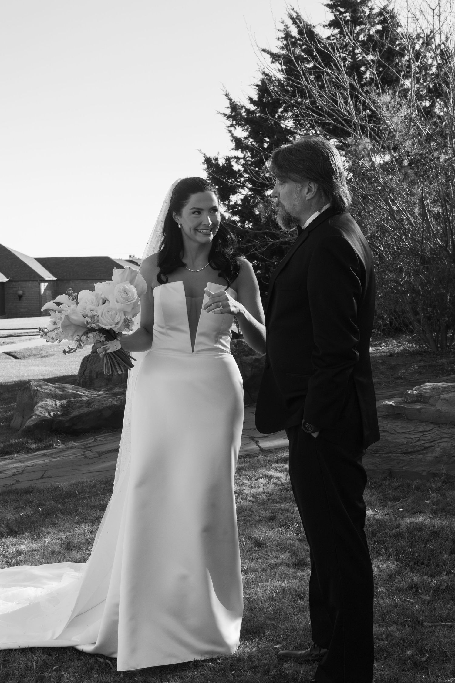 An elegant outdoor winter wedding photoshoot with white floral bouquets.