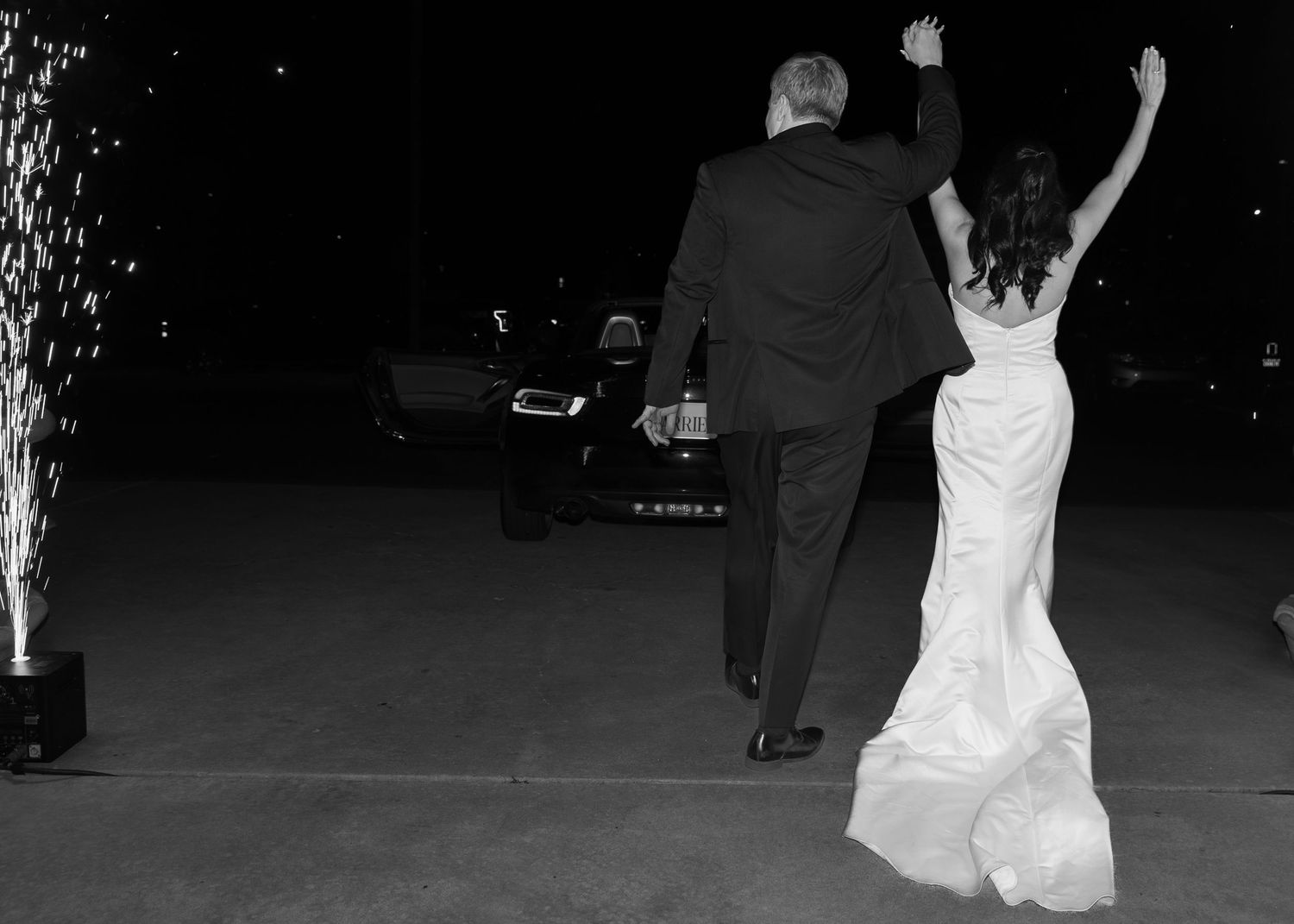 Black and white silhouettes dancing at an evening celebration.