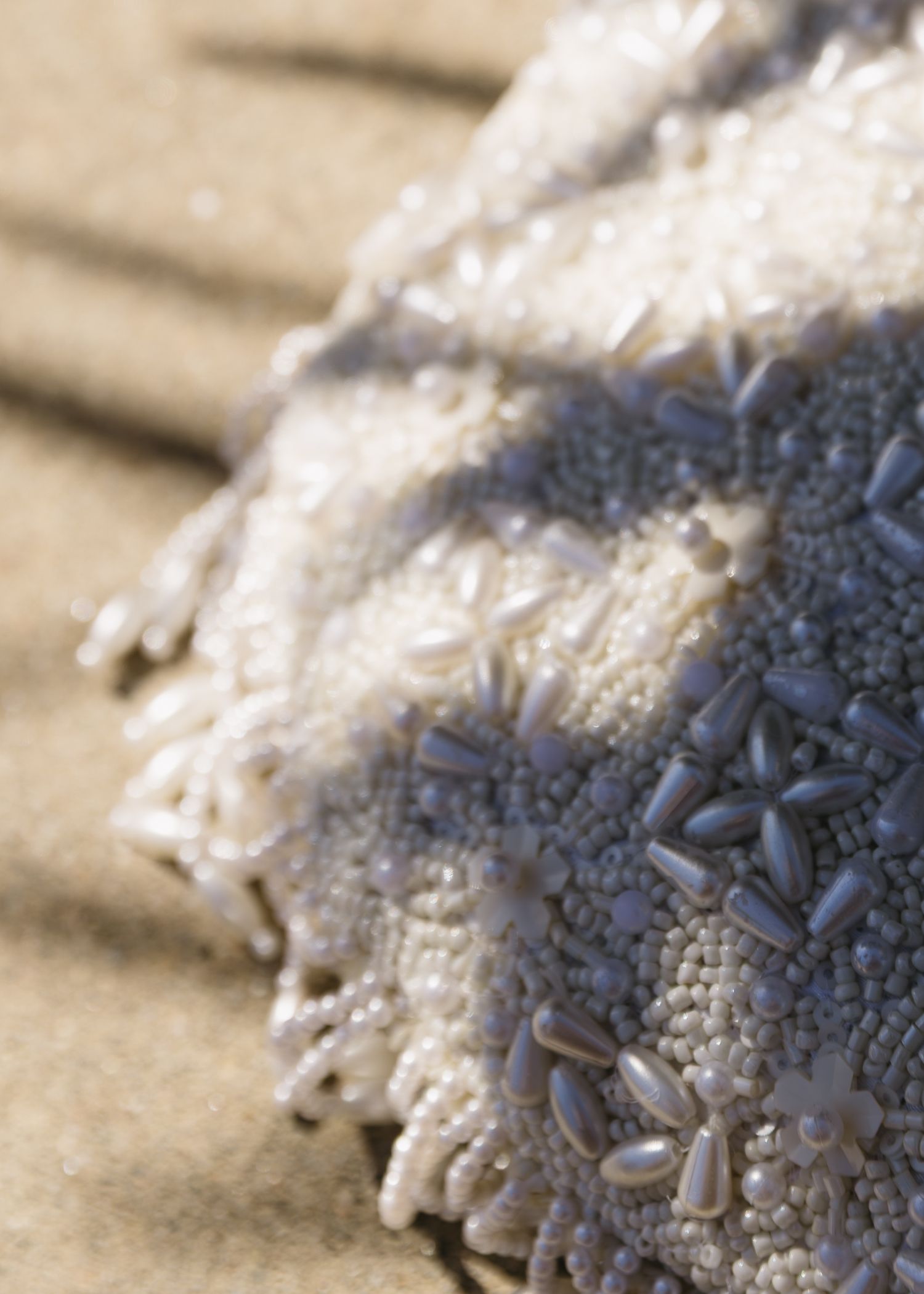 Extreme close-up macro shot of intricate lace fabric details.