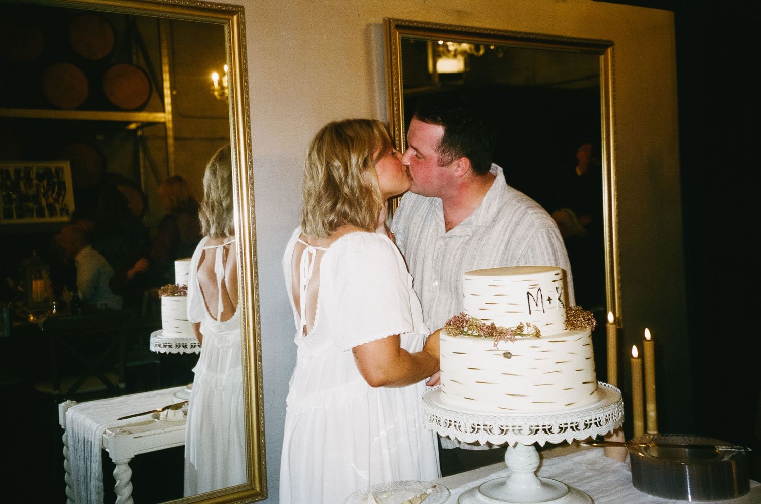 A sequence of romantic moments captured at a wedding reception with a couple embracing in dim lighting.