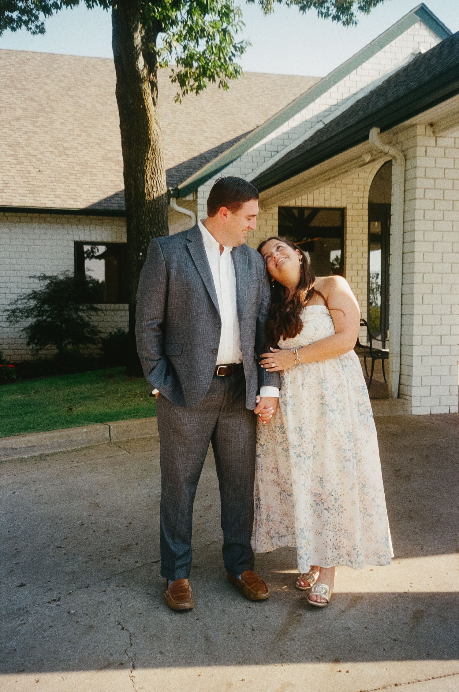 A series of candid moments captured outside a white brick building during a special occasion.