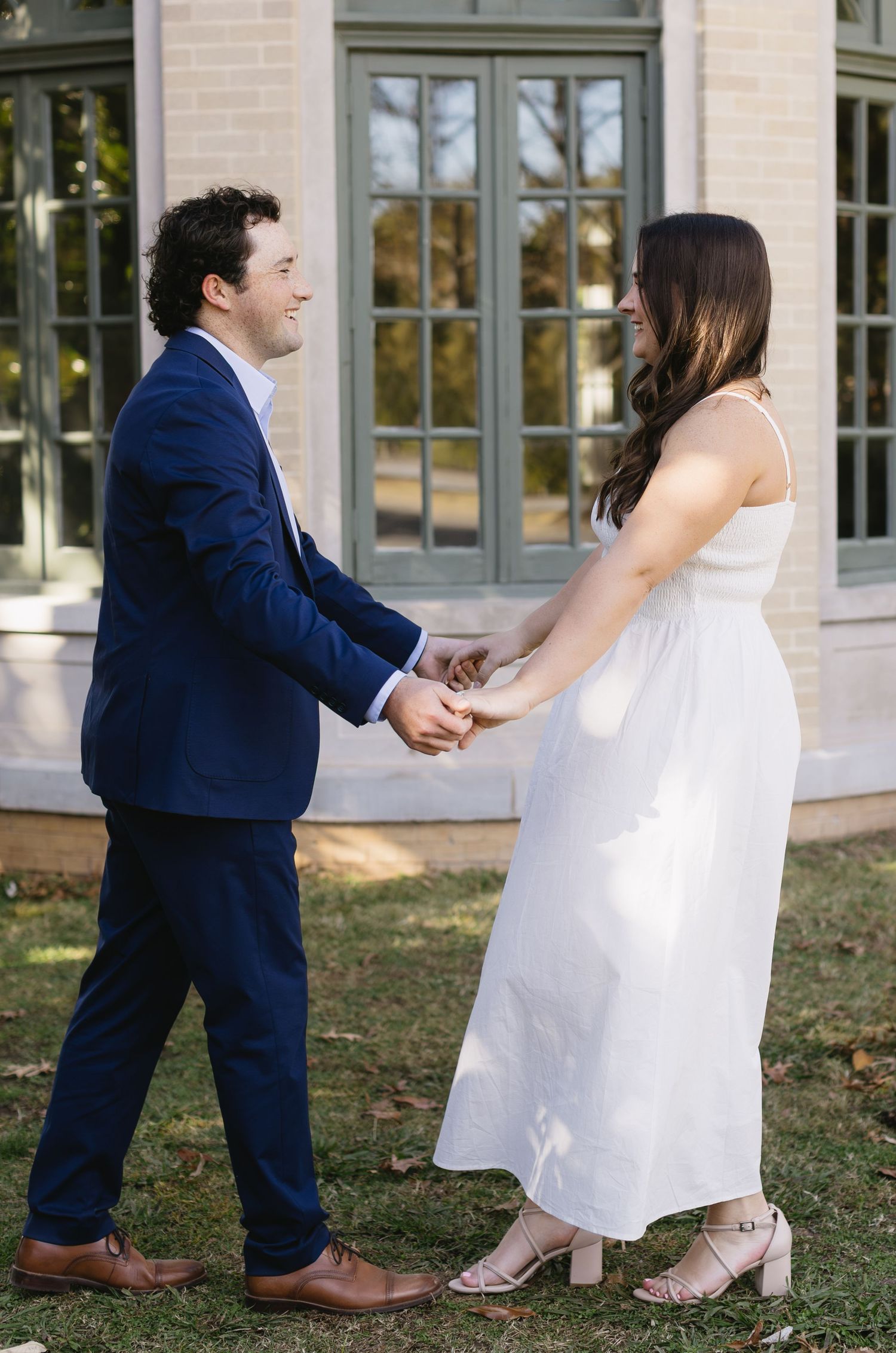 A sequence of four photos showing a couple in wedding attire playfully dancing together on a lawn.