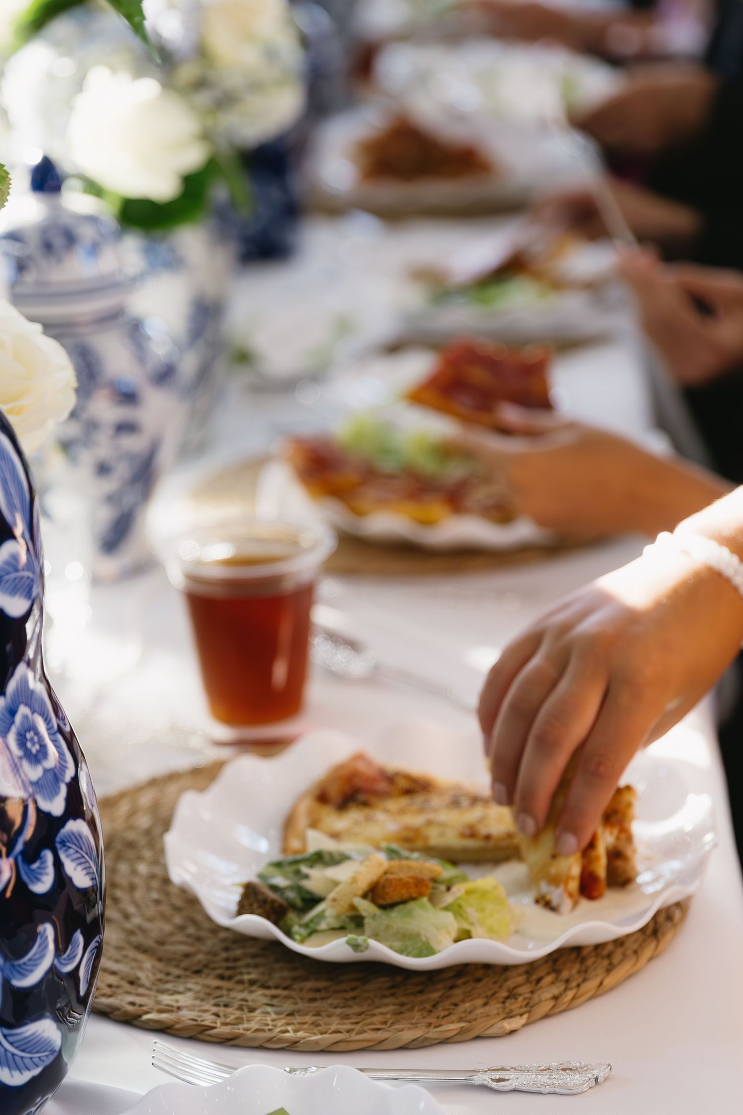 Table setting with blue and white porcelain dishes and casual dining plates.