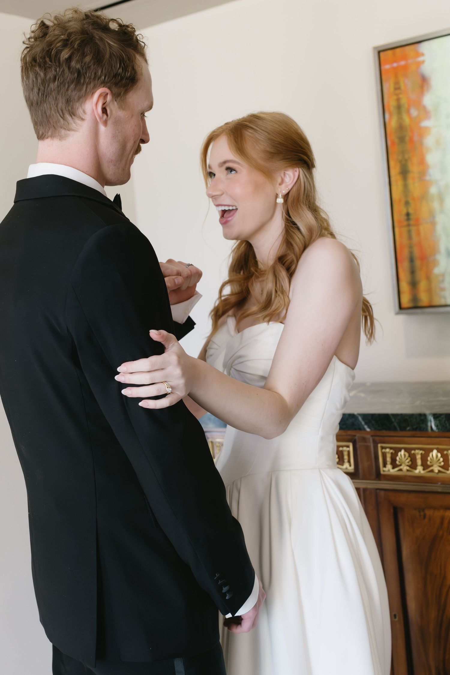 Intimate getting ready sequence of couple in formal wedding attire.