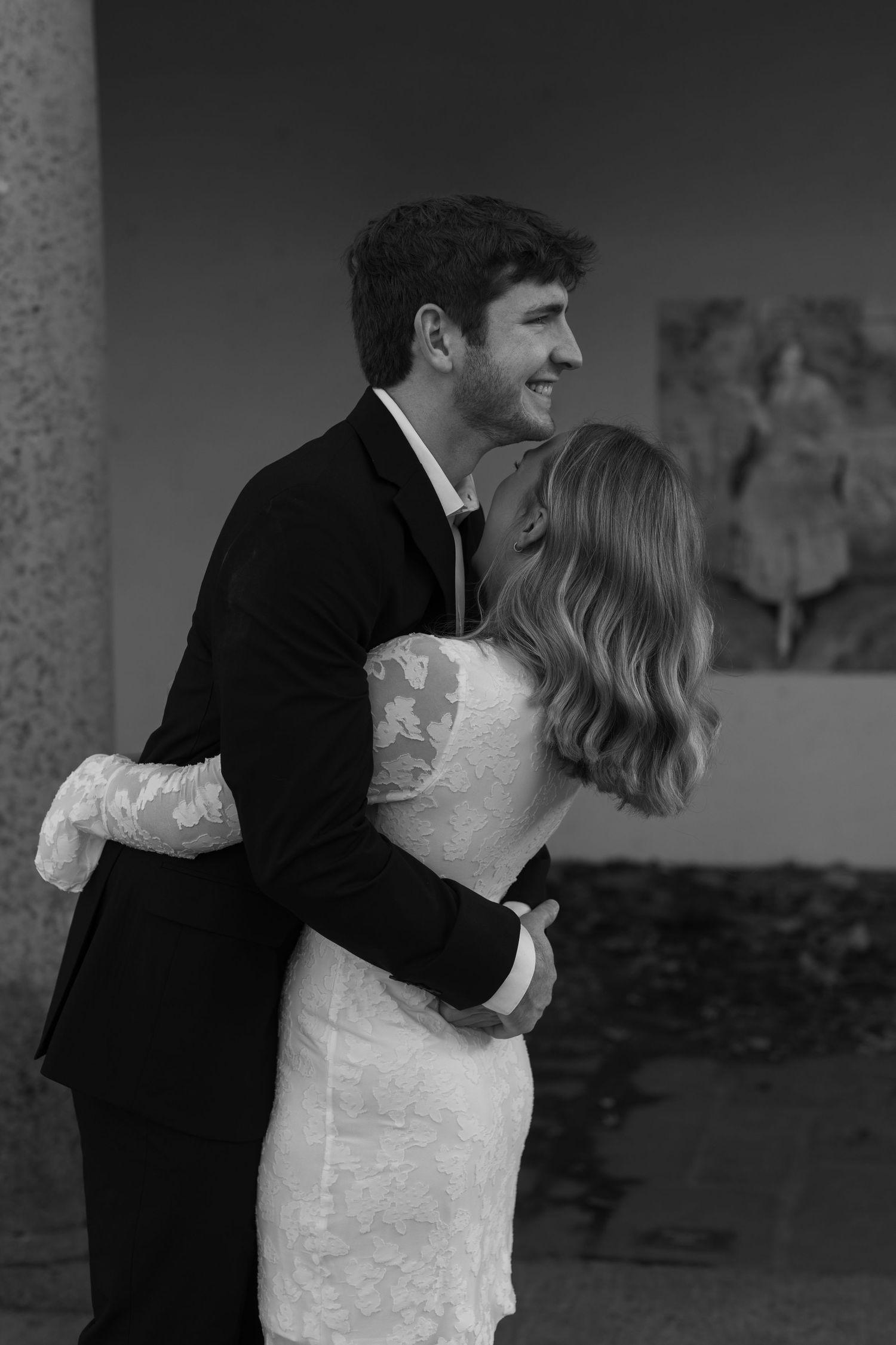 A black and white wedding photo sequence capturing playful moments between a couple.
