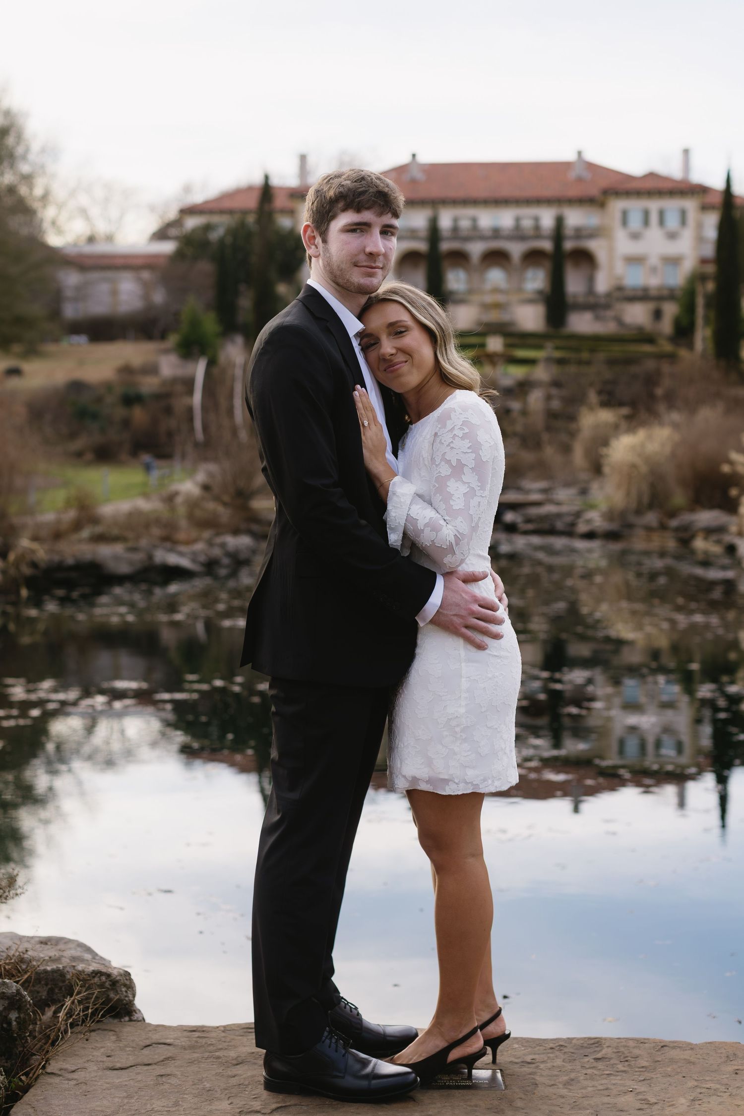 A romantic photo series capturing tender moments between a couple by a lakeside.