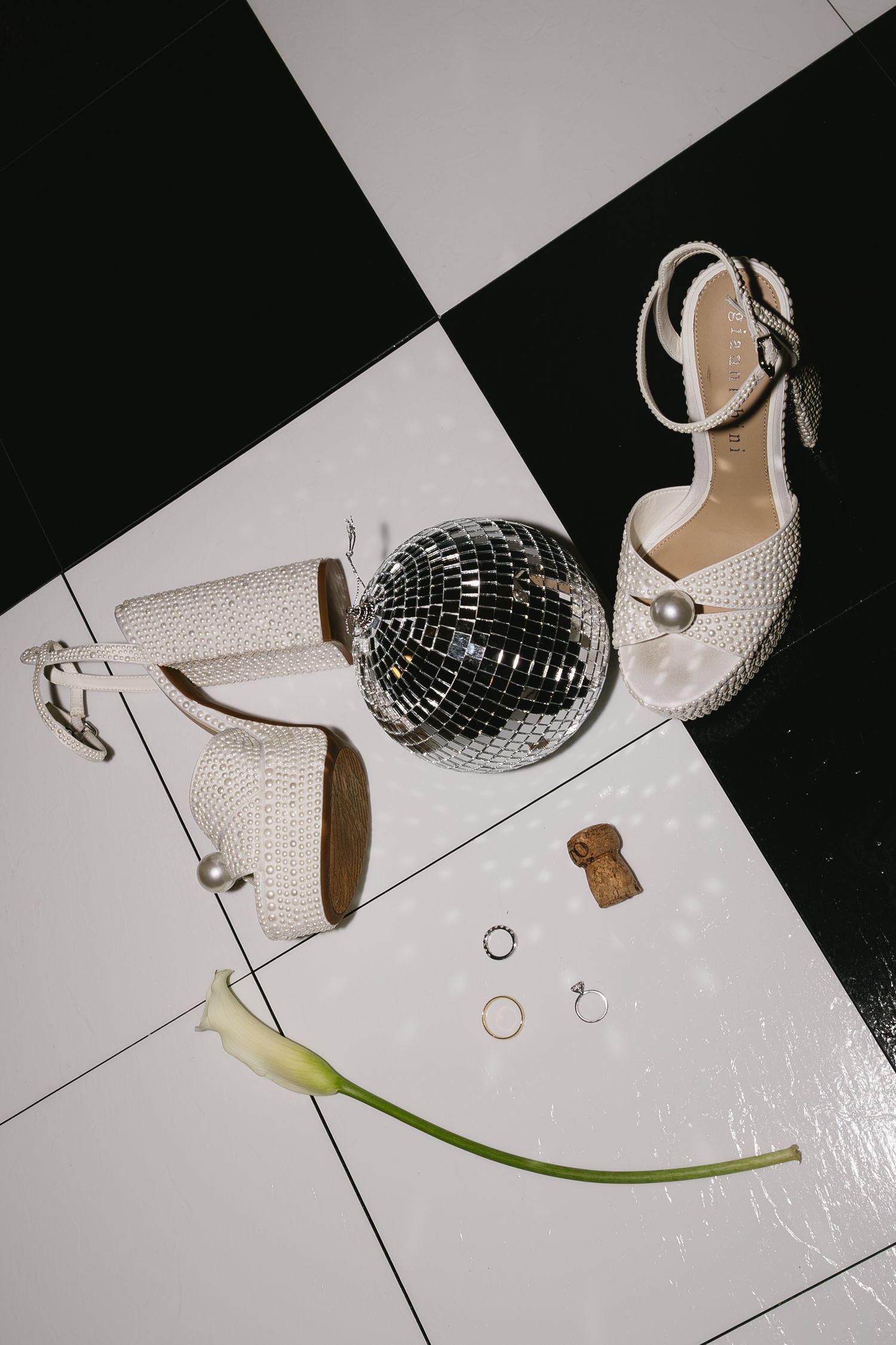 A sequence of six photos showing a disco ball and silver high heel shoe arranged in different compositions on a black and white surface.