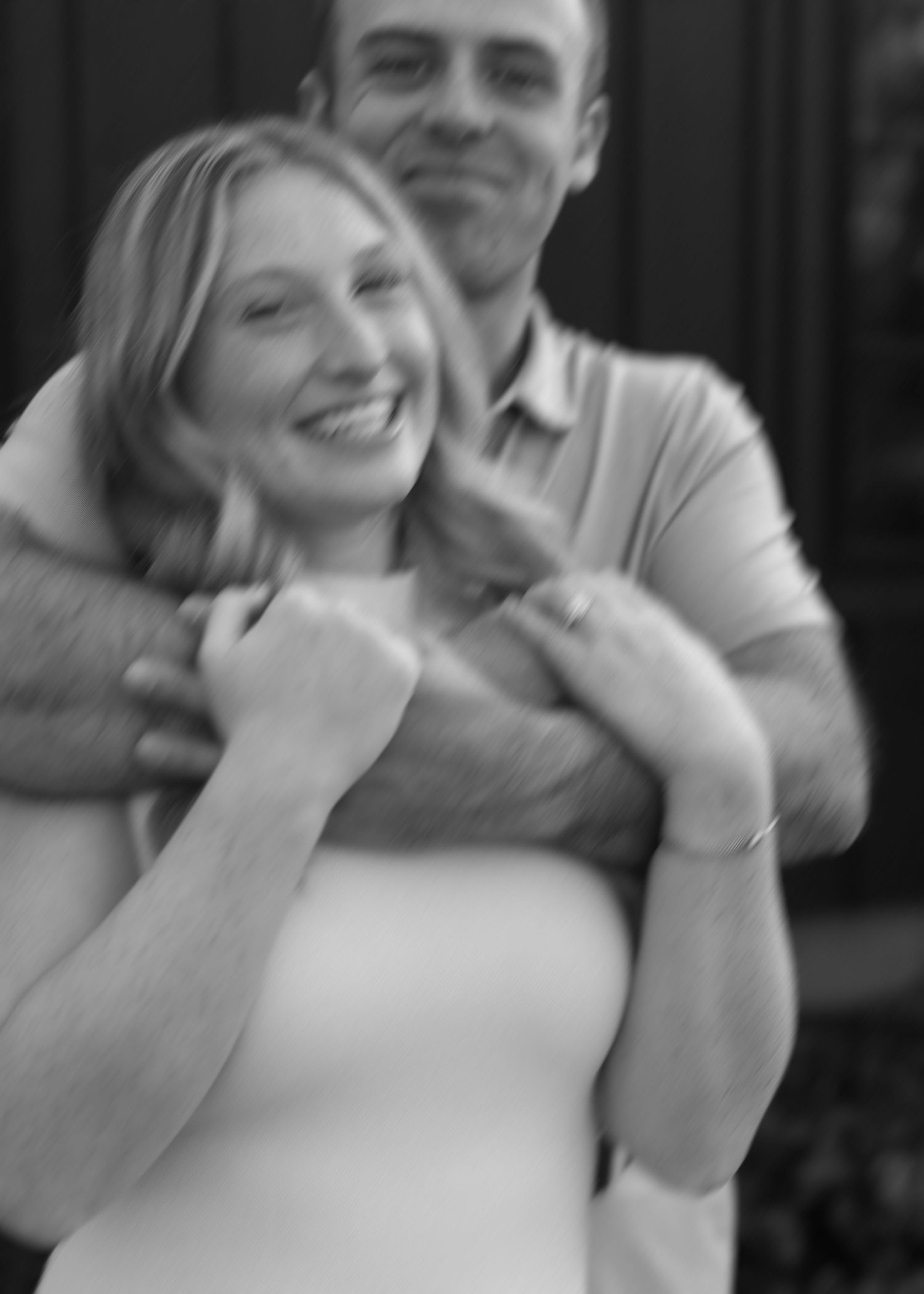 A series of black and white photos showing a couple sharing playful moments together.