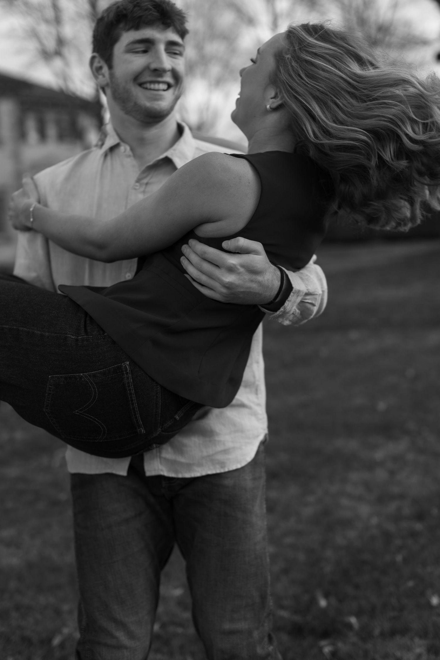 Black and white photos showing playful moments between a couple outdoors.