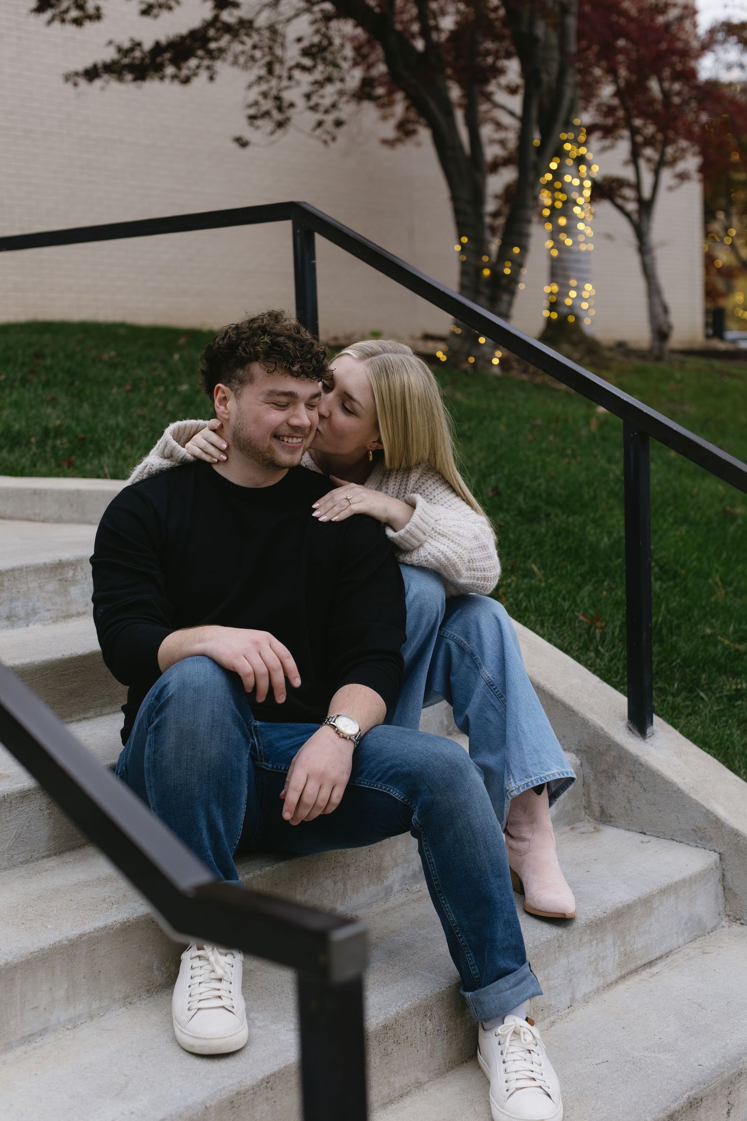 A couple sits together on concrete steps sharing intimate moments in a series of connected romantic photos.