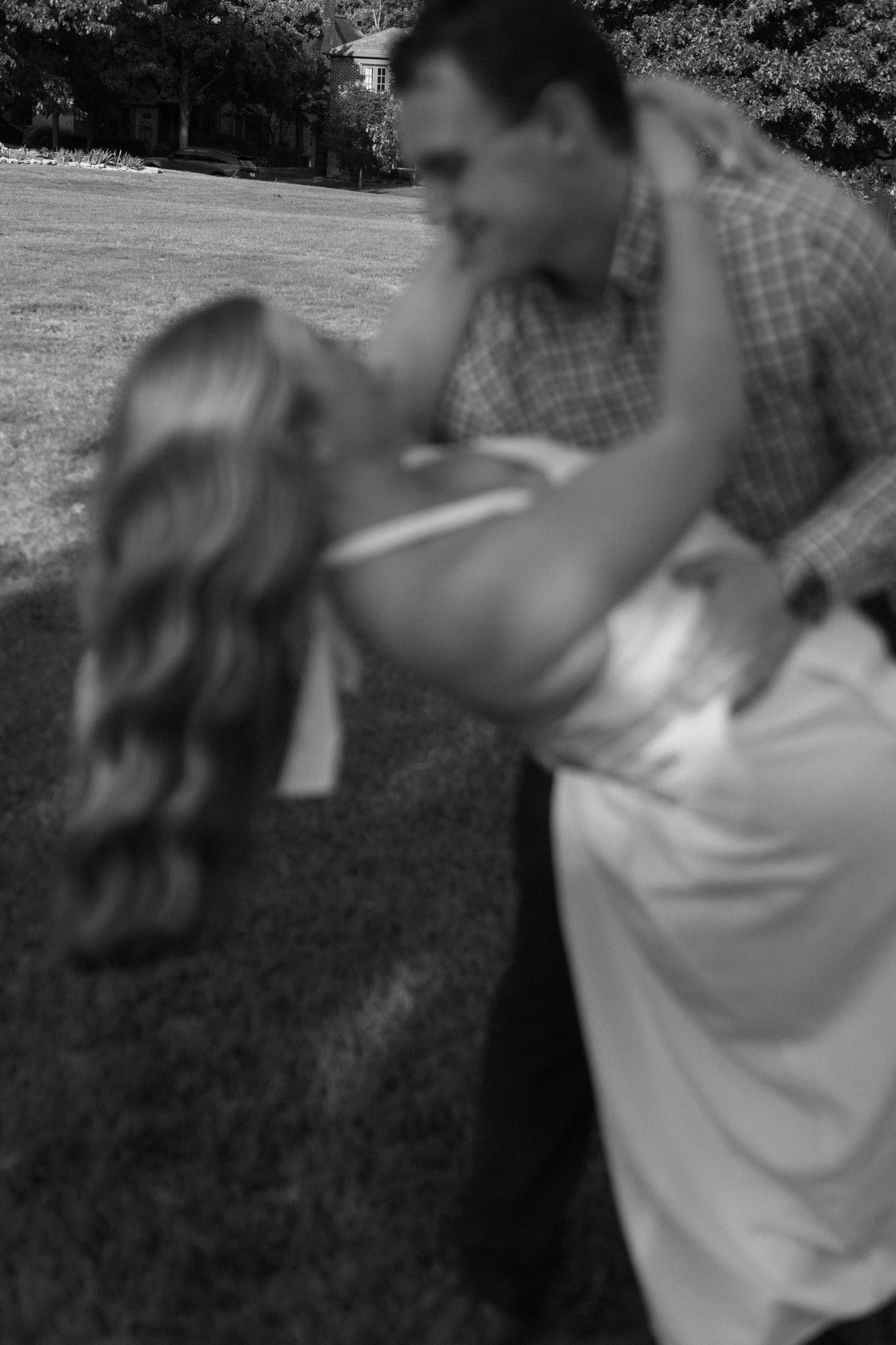 A romantic black and white photo sequence captured in a garden setting.