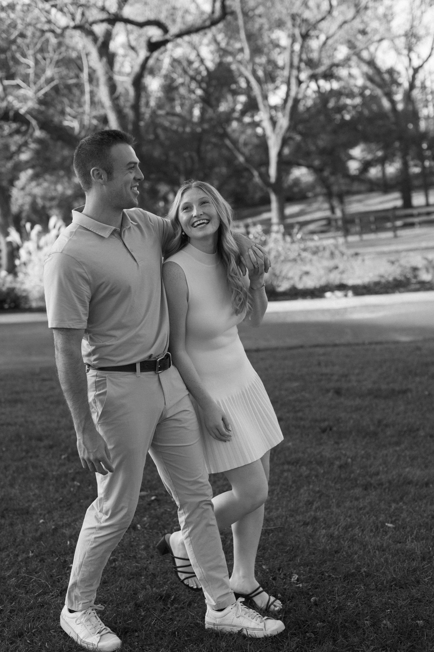 Black and white series of playful couple moments captured in an outdoor setting.