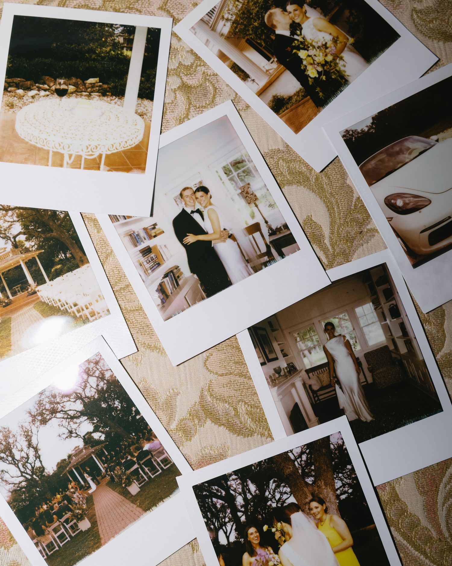 Collection of vintage polaroid photographs scattered on a surface showing memories and moments from the past.