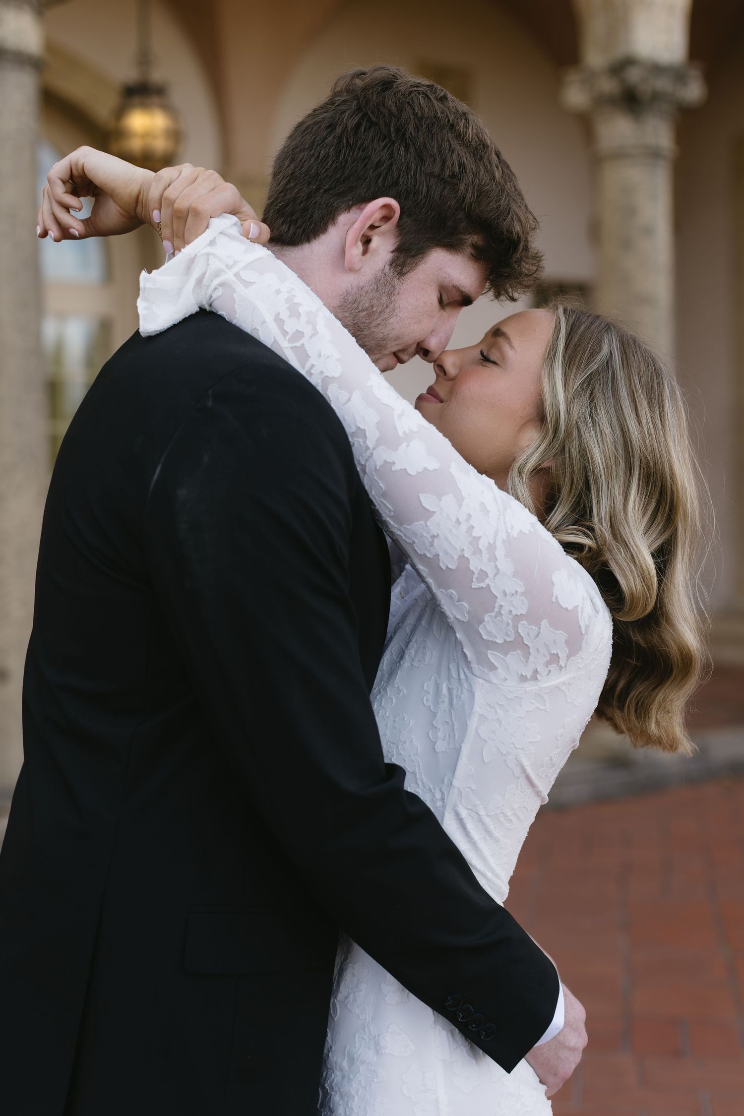 A romantic series of wedding photos showing a couple embracing in an elegant outdoor setting.