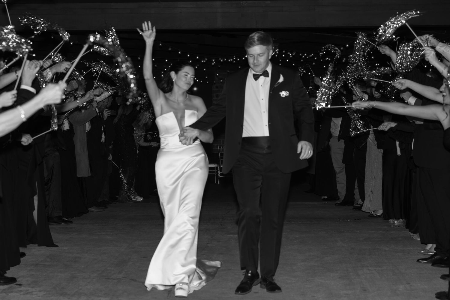 Wedding celebration exit with sparklers creating a magical nighttime atmosphere.