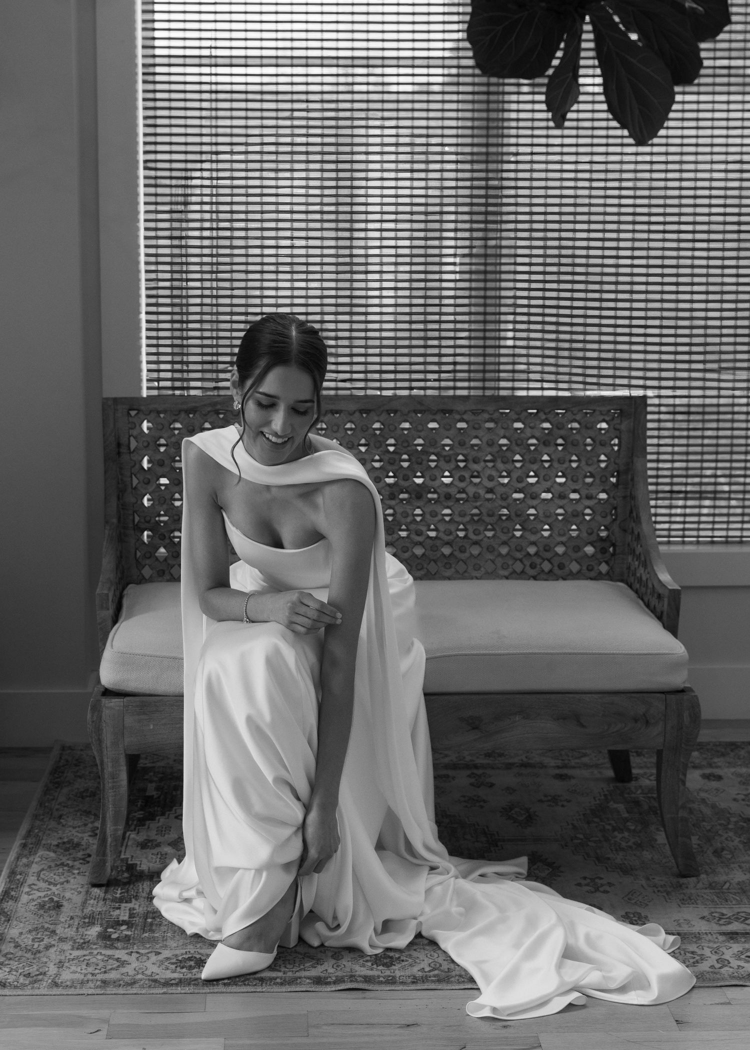 Black and white photos showing intimate moments of a bride sitting on a bench.