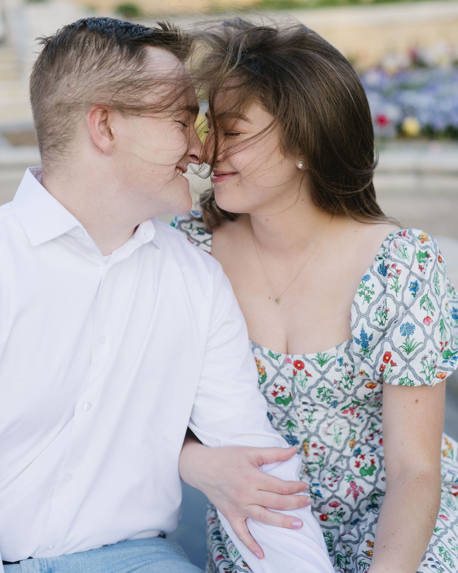 A tender moment captured in natural light during a spring outdoor photo session.