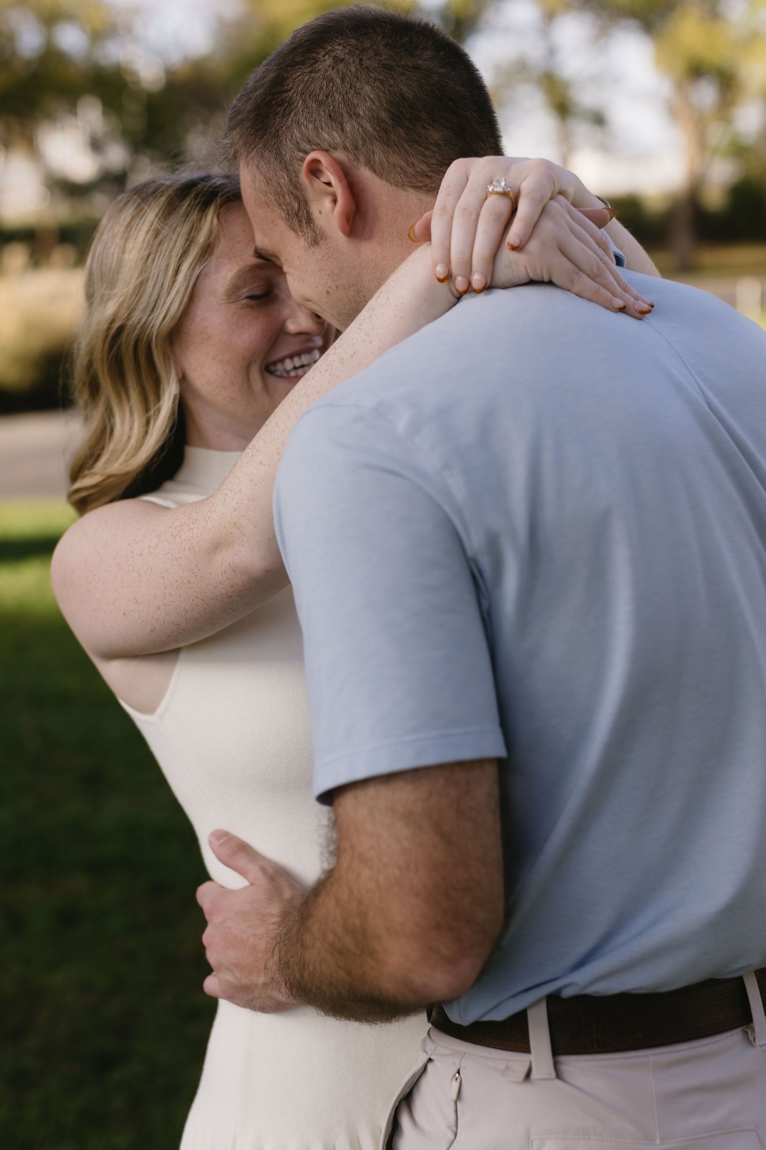 Romantic sequence of a couple embracing outdoors in soft natural lighting.