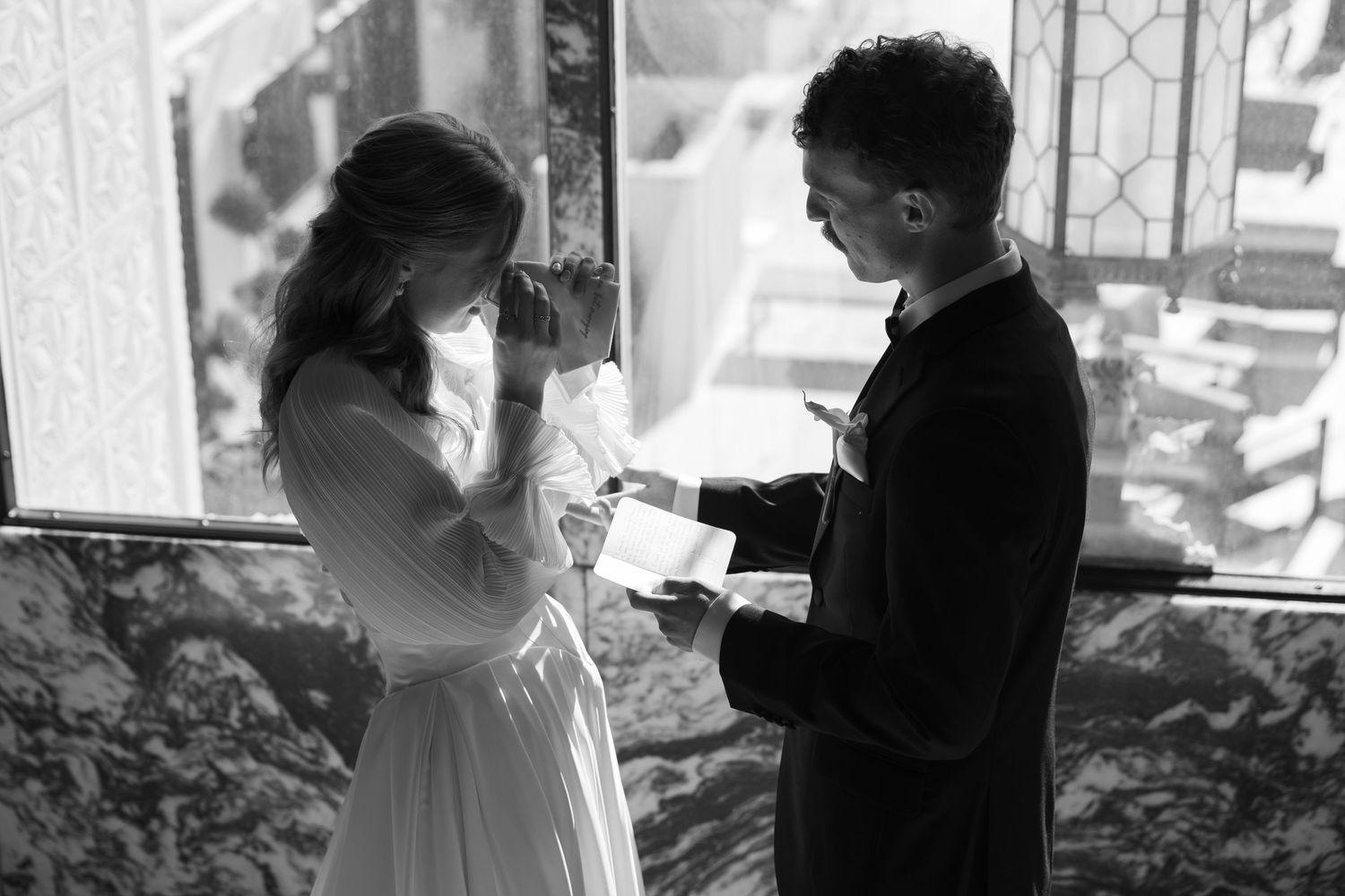 Black and white first look moment captured between couple on their wedding day.