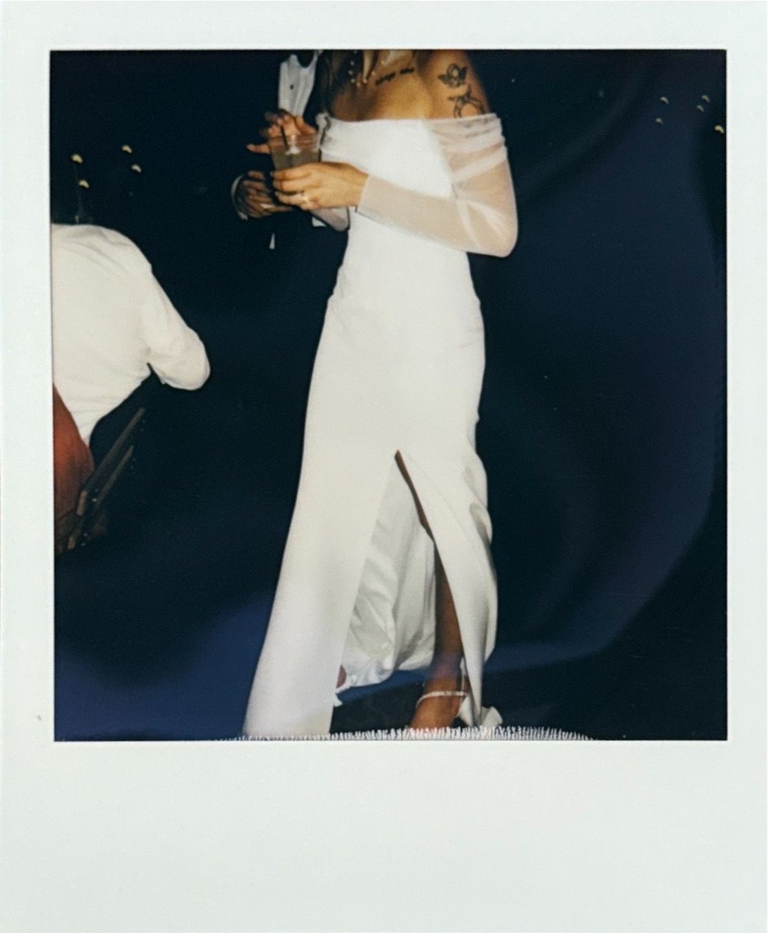 Dancing figures in formal attire captured in instant photo style frames.